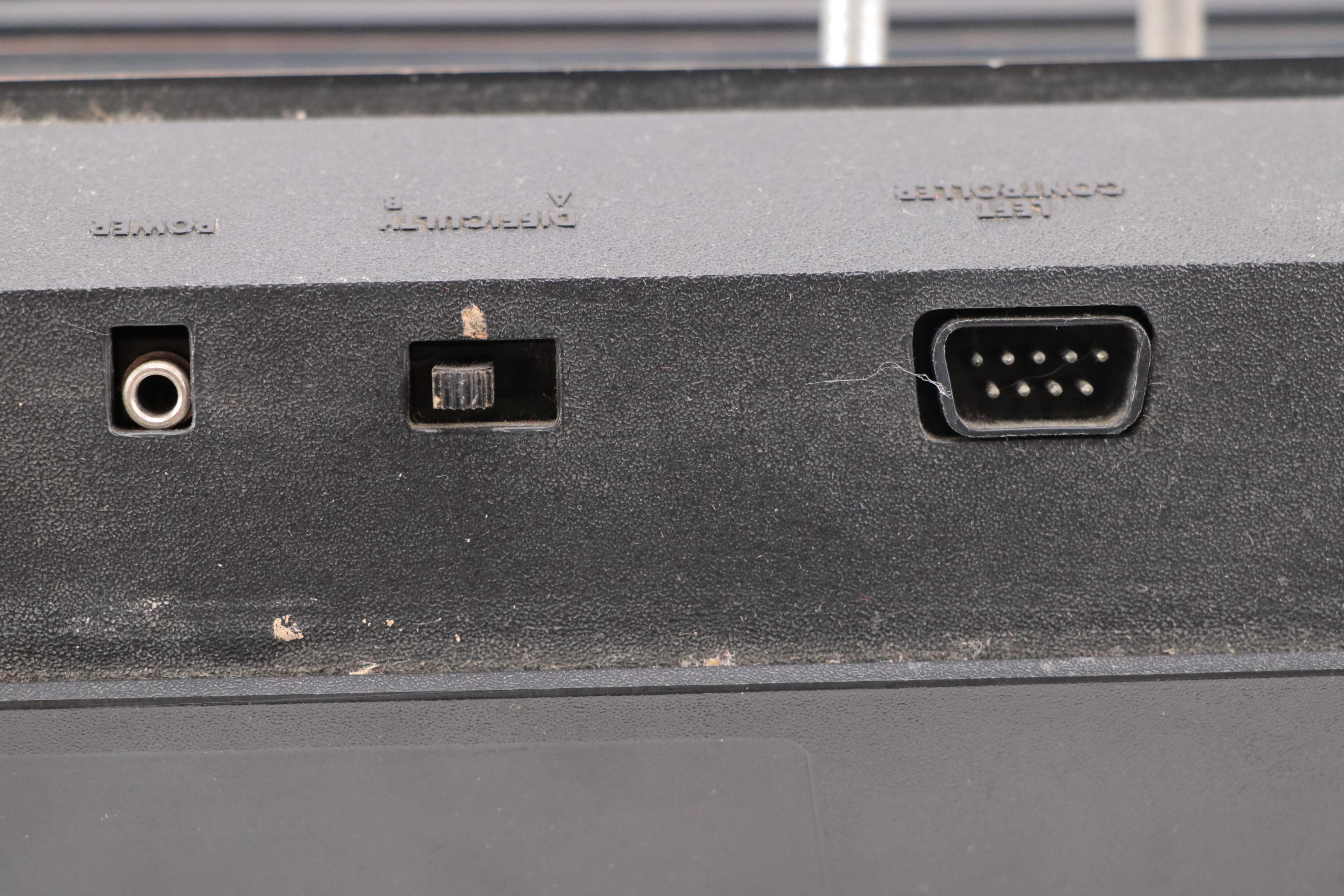 Atari 2600 Console with "Donkey Kong", "Frogger", "Pac-Man", and More