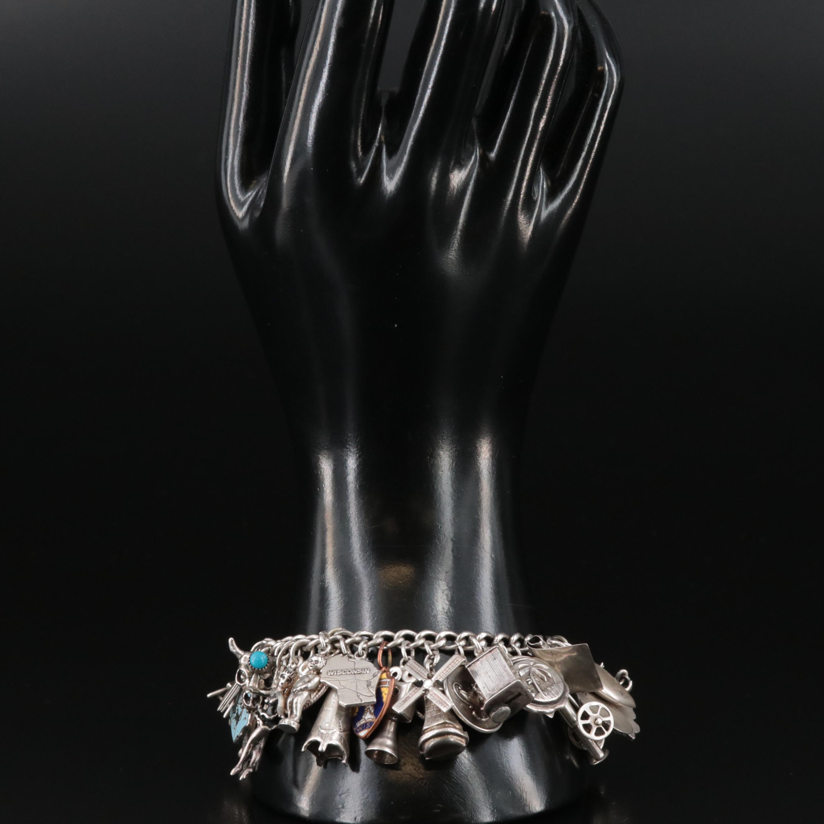 Sterling Charm Bracelet Including Articulated, Travel and Bell Trading Post