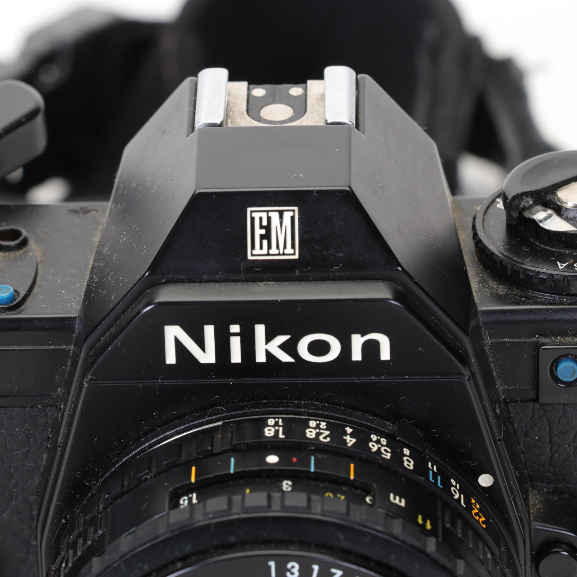 Nikon EM SLR with f/1.8 50mm and Other Camera Accessories