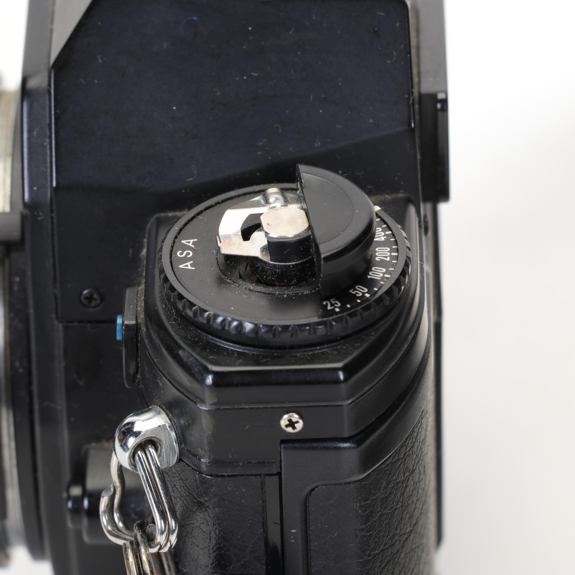 Nikon EM SLR with f/1.8 50mm and Other Camera Accessories