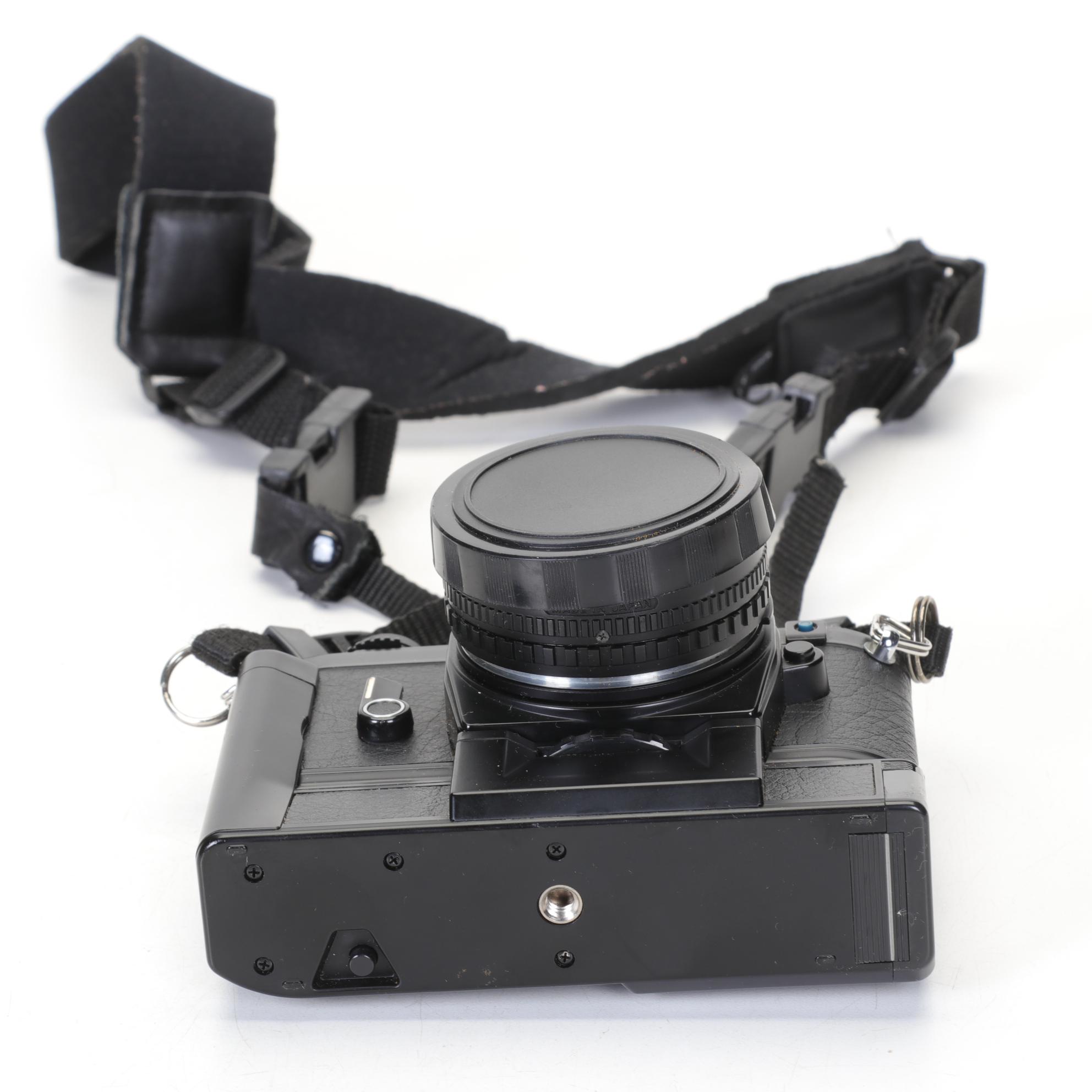 Nikon EM SLR with f/1.8 50mm and Other Camera Accessories