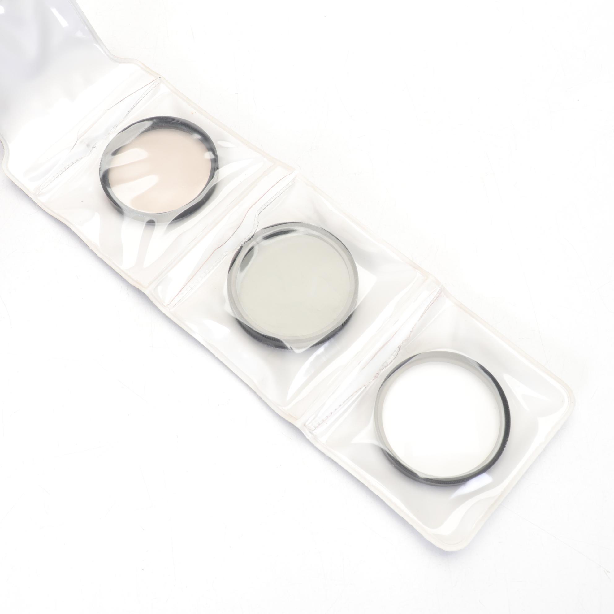 Nikon EM SLR with f/1.8 50mm and Other Camera Accessories