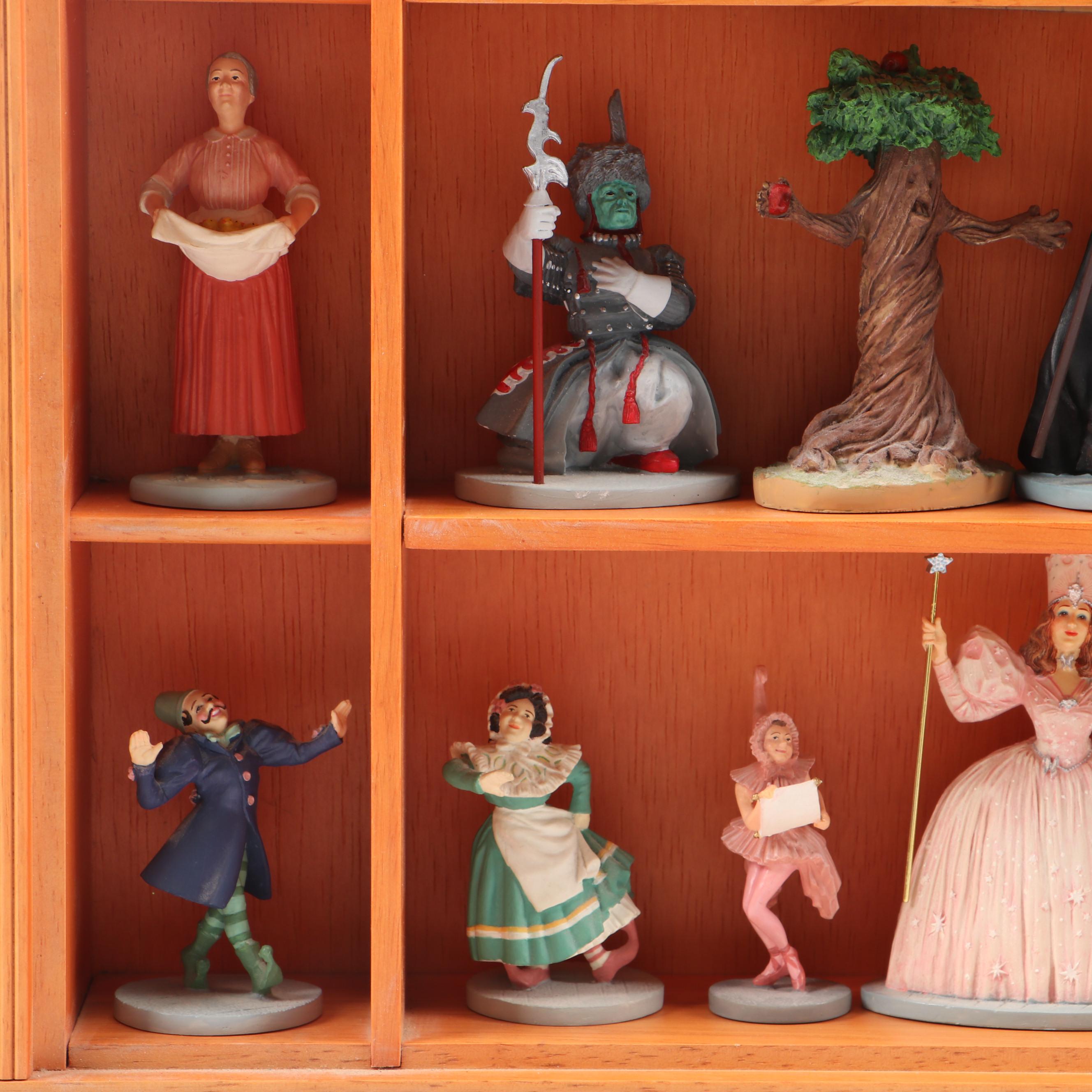 "Wizard of Oz" Figurines and Display Cabinet including "Tin Man" and "Auntie Em"