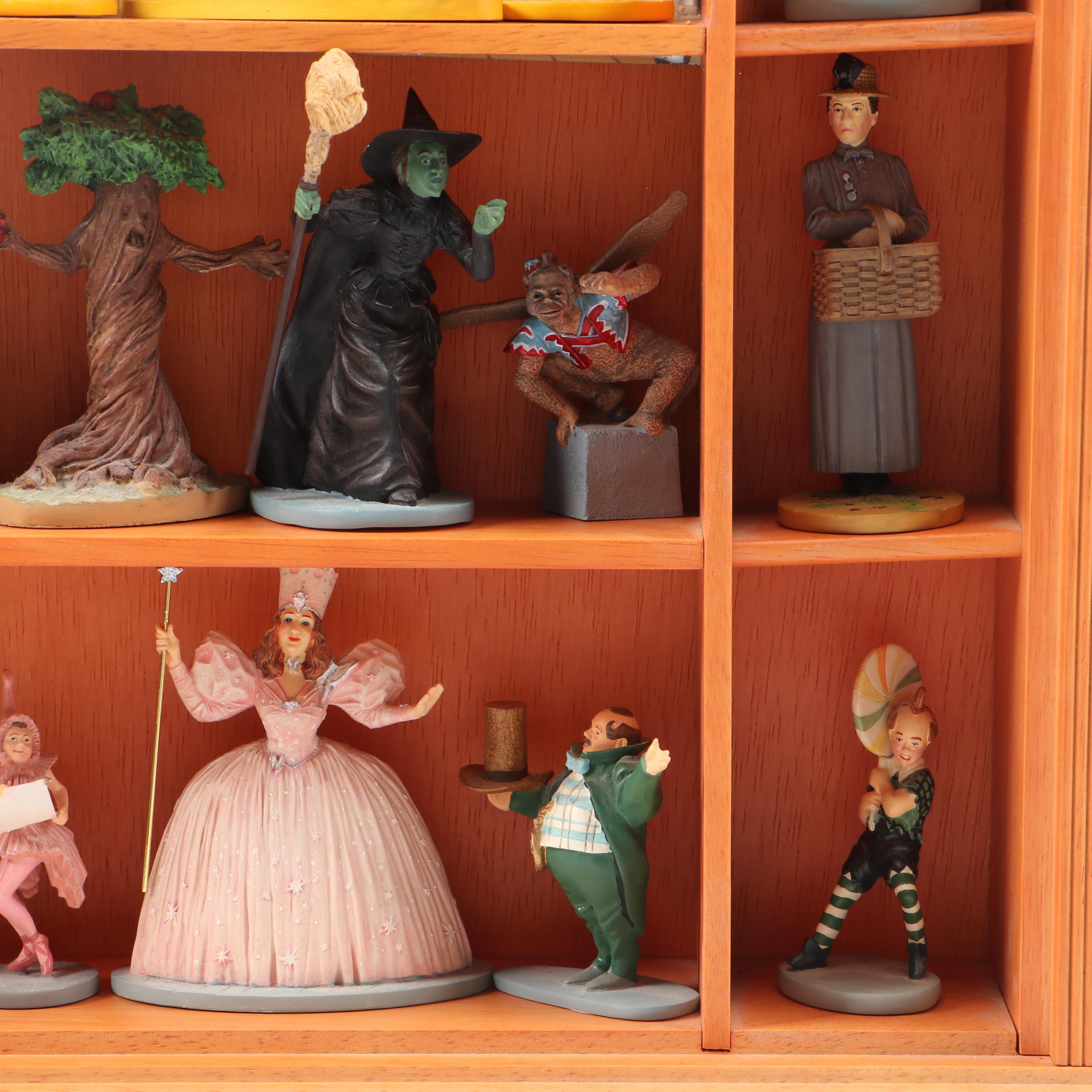 "Wizard of Oz" Figurines and Display Cabinet including "Tin Man" and "Auntie Em"