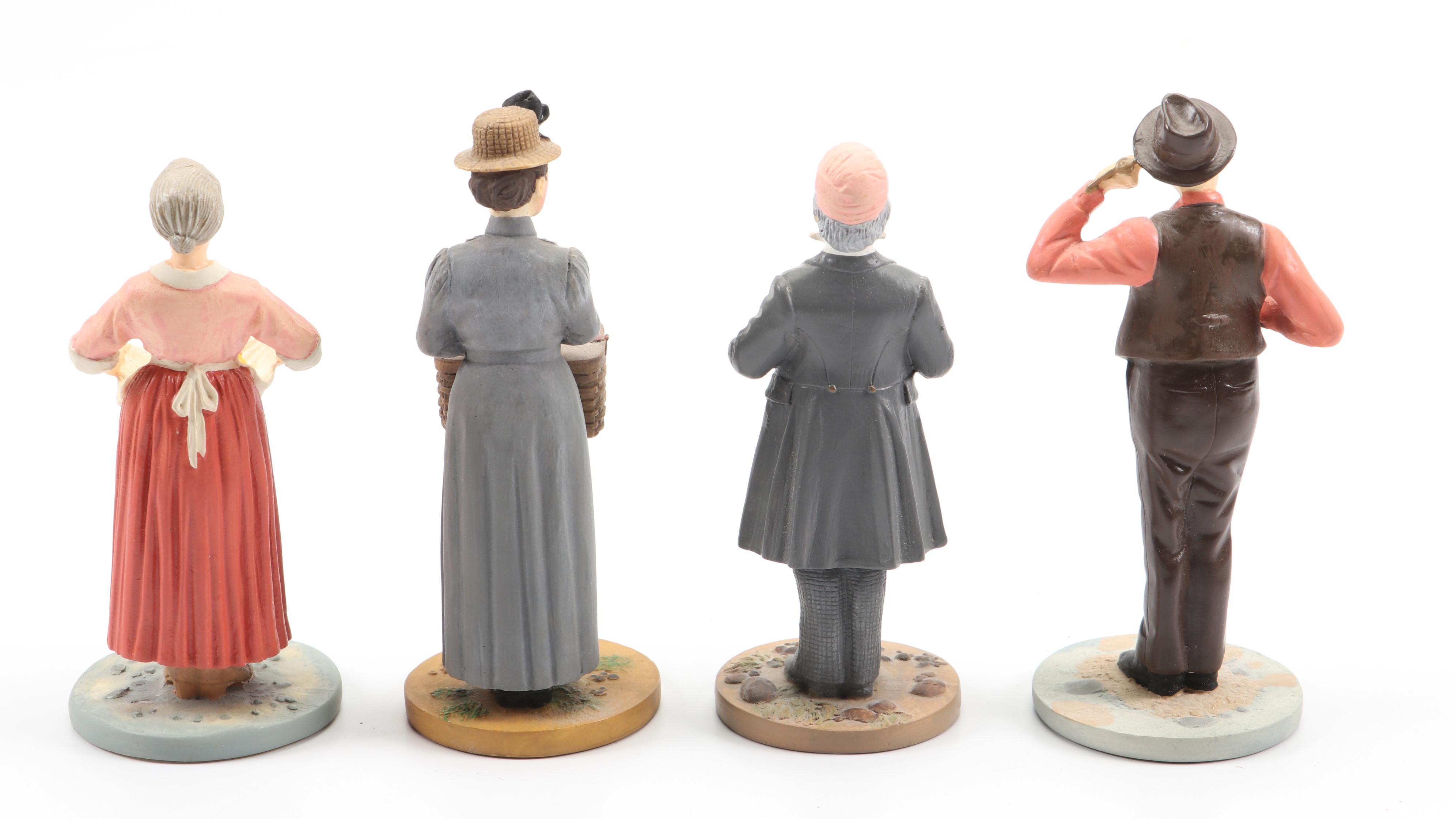 "Wizard of Oz" Figurines and Display Cabinet including "Tin Man" and "Auntie Em"