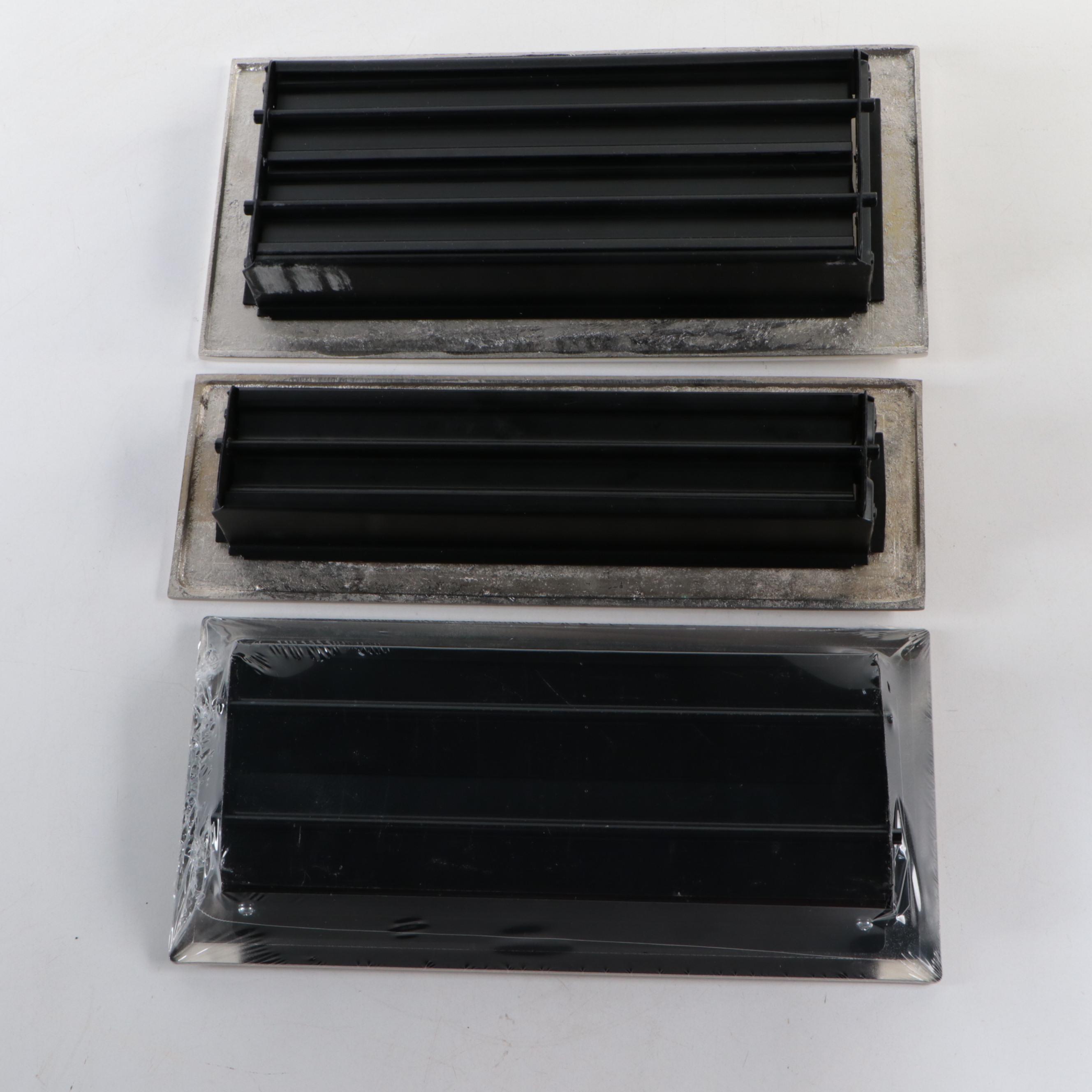 Matte Black and Brushed Nickel Floor Registers