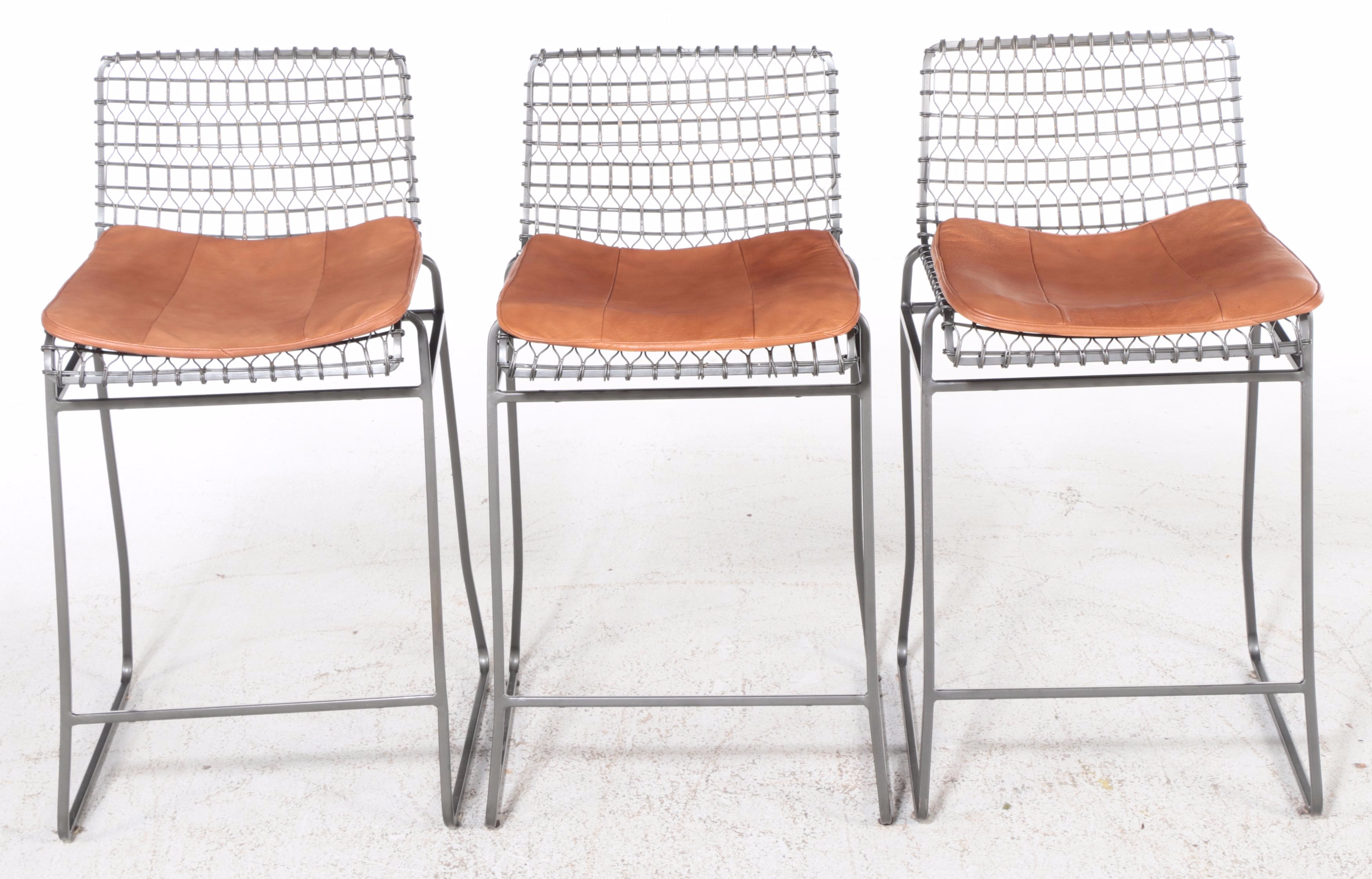 Four Crate & Barrel "Tig Metal" Iron and Brass Counter Stools