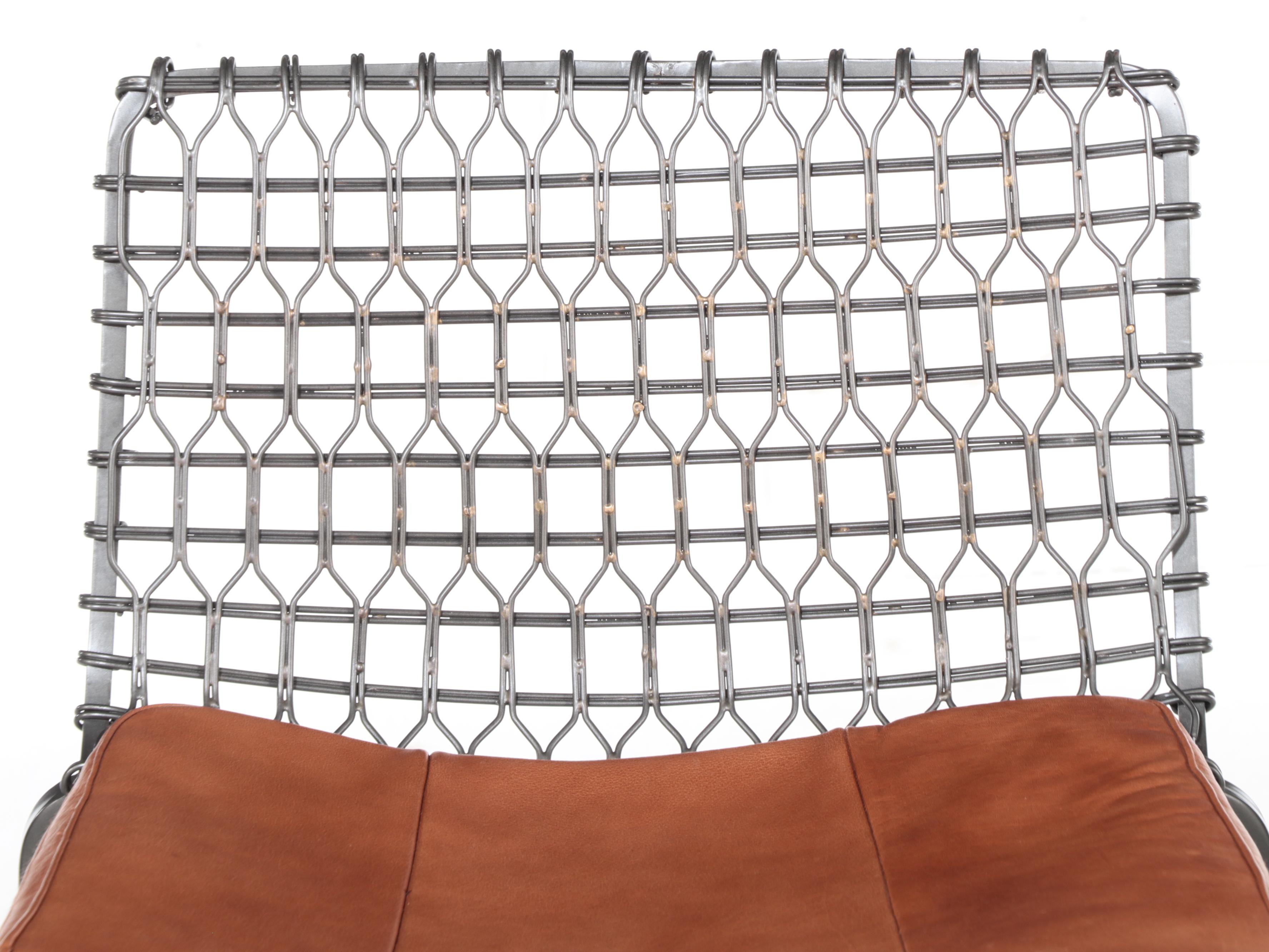 Four Crate & Barrel "Tig Metal" Iron and Brass Counter Stools