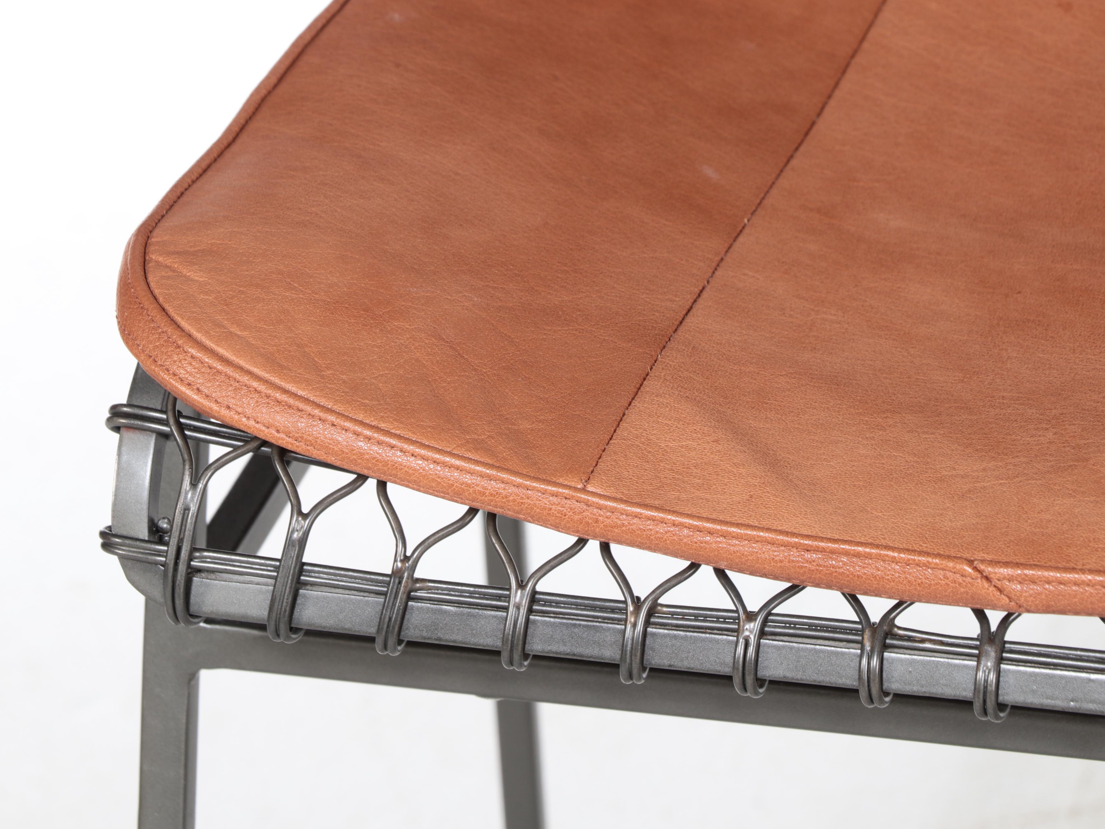 Four Crate & Barrel "Tig Metal" Iron and Brass Counter Stools