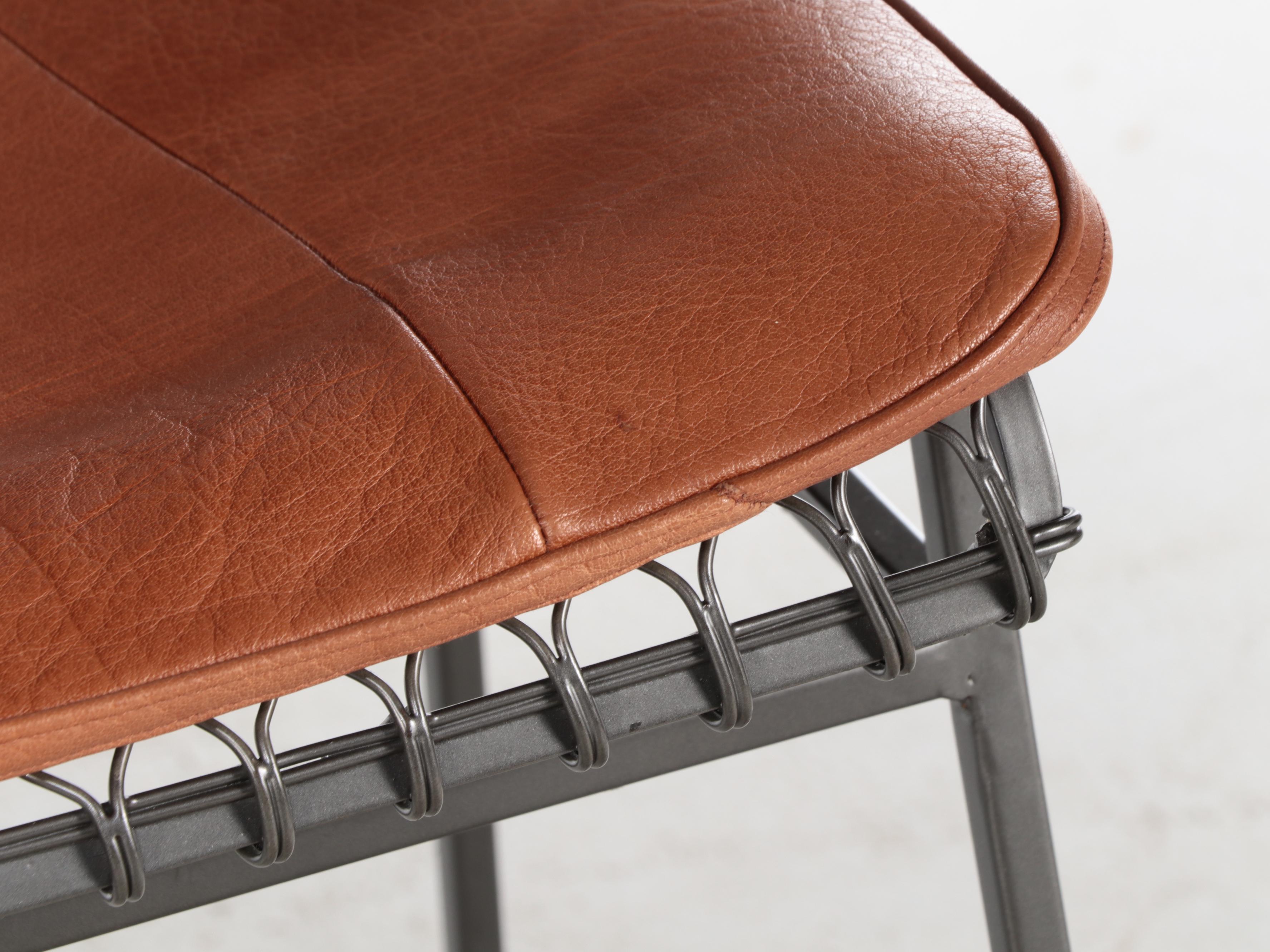 Four Crate & Barrel "Tig Metal" Iron and Brass Counter Stools