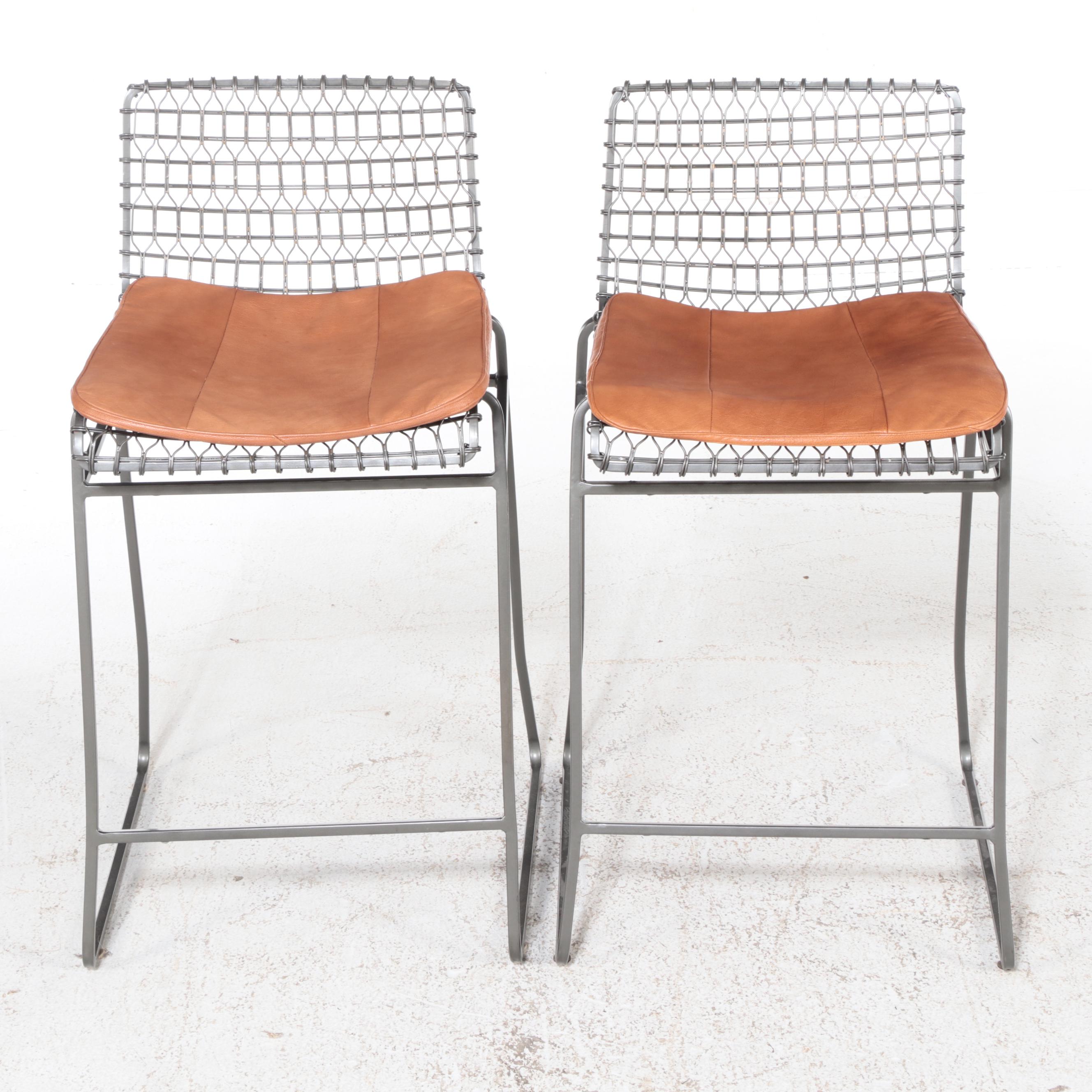 Four Crate & Barrel "Tig Metal" Iron and Brass Counter Stools