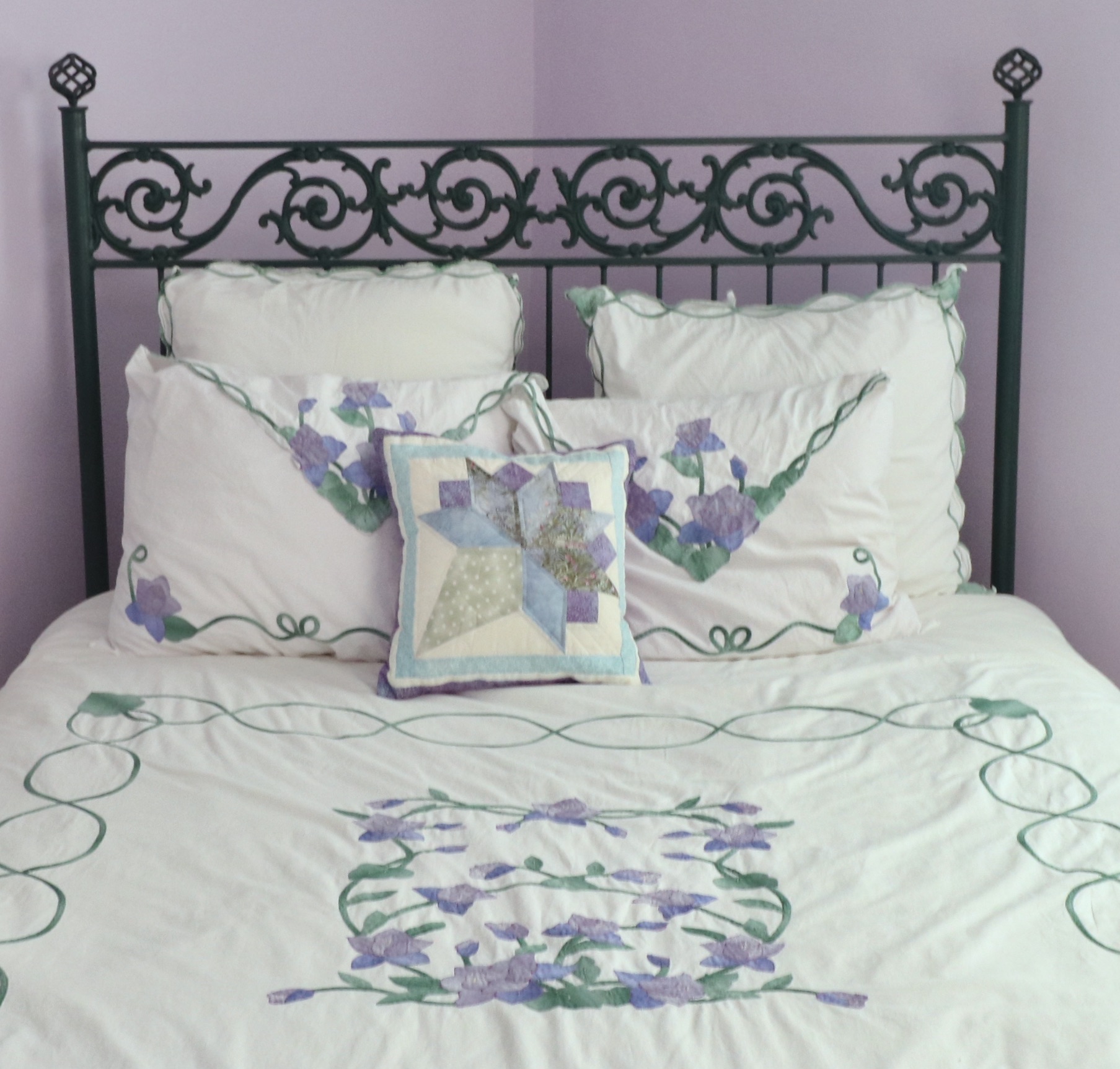 Wrought Iron Queen Bed Frame with Side Table and Floral Appliqué Cotton Bedding