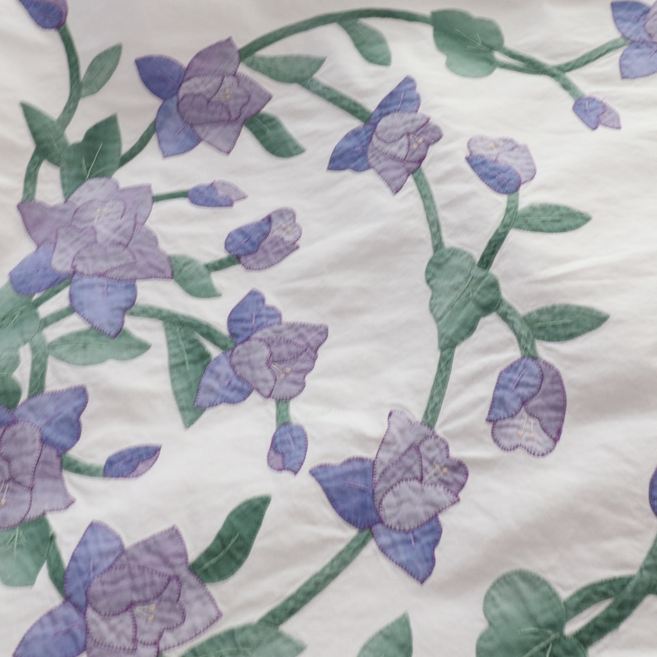 Wrought Iron Queen Bed Frame with Side Table and Floral Appliqué Cotton Bedding