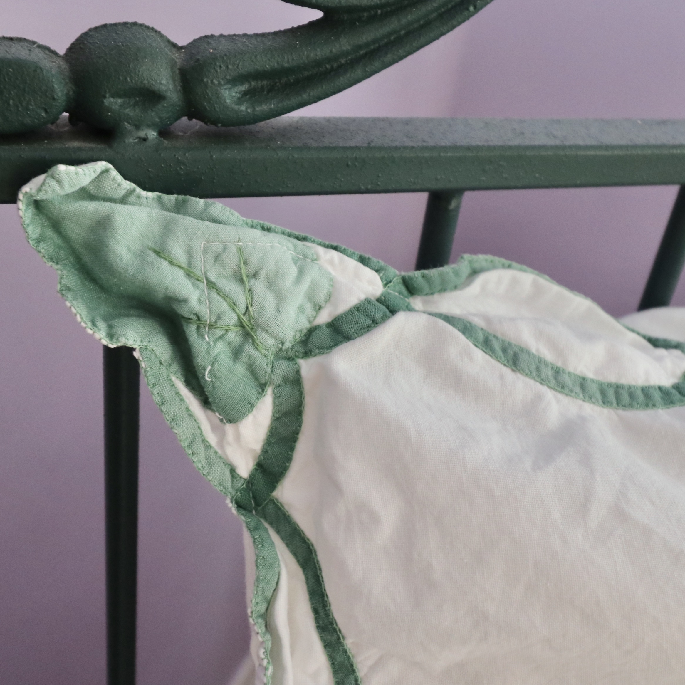 Wrought Iron Queen Bed Frame with Side Table and Floral Appliqué Cotton Bedding