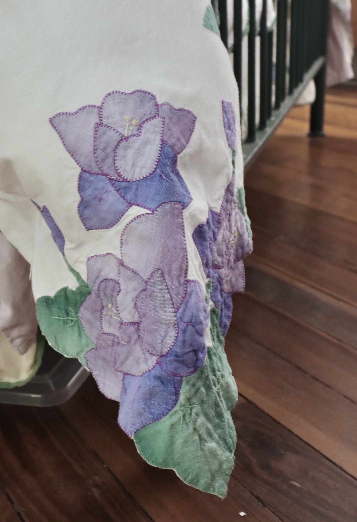 Wrought Iron Queen Bed Frame with Side Table and Floral Appliqué Cotton Bedding