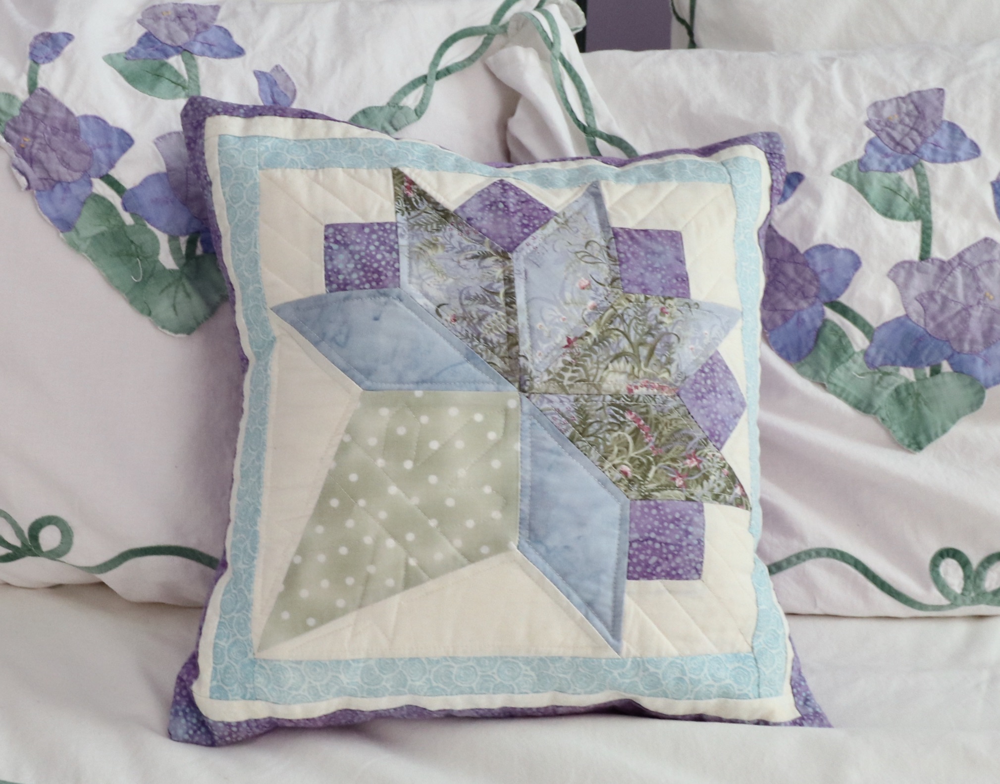 Wrought Iron Queen Bed Frame with Side Table and Floral Appliqué Cotton Bedding