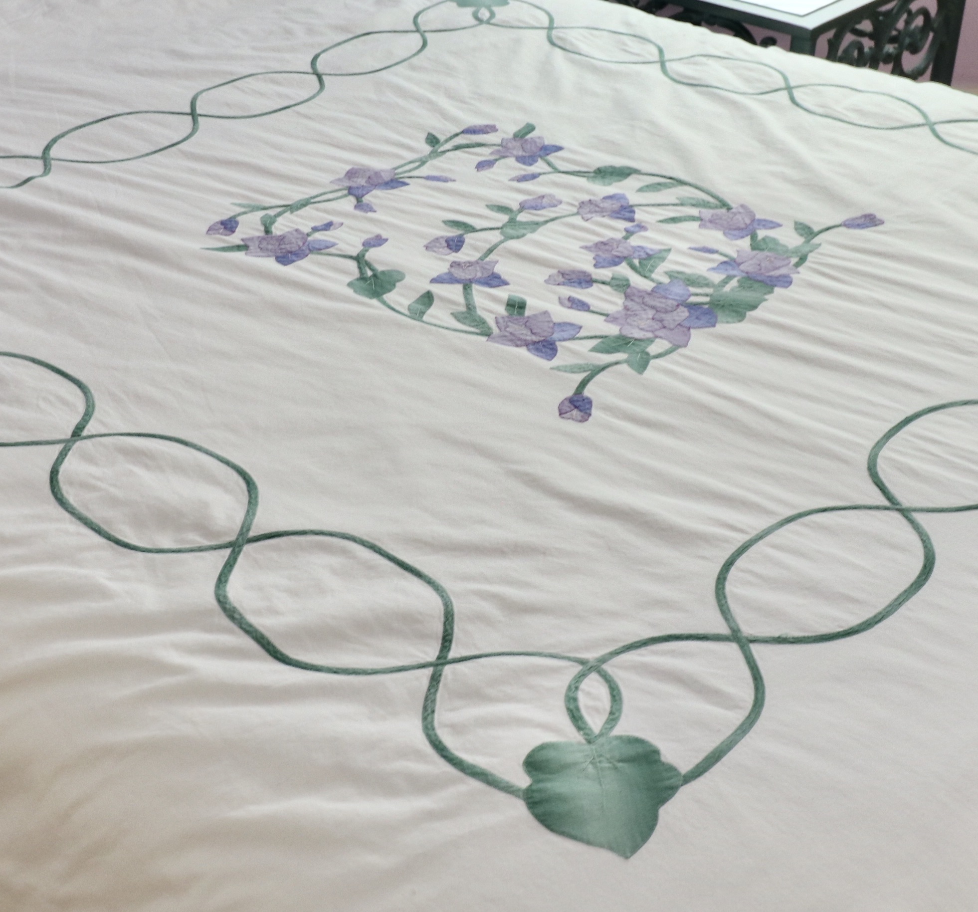 Wrought Iron Queen Bed Frame with Side Table and Floral Appliqué Cotton Bedding