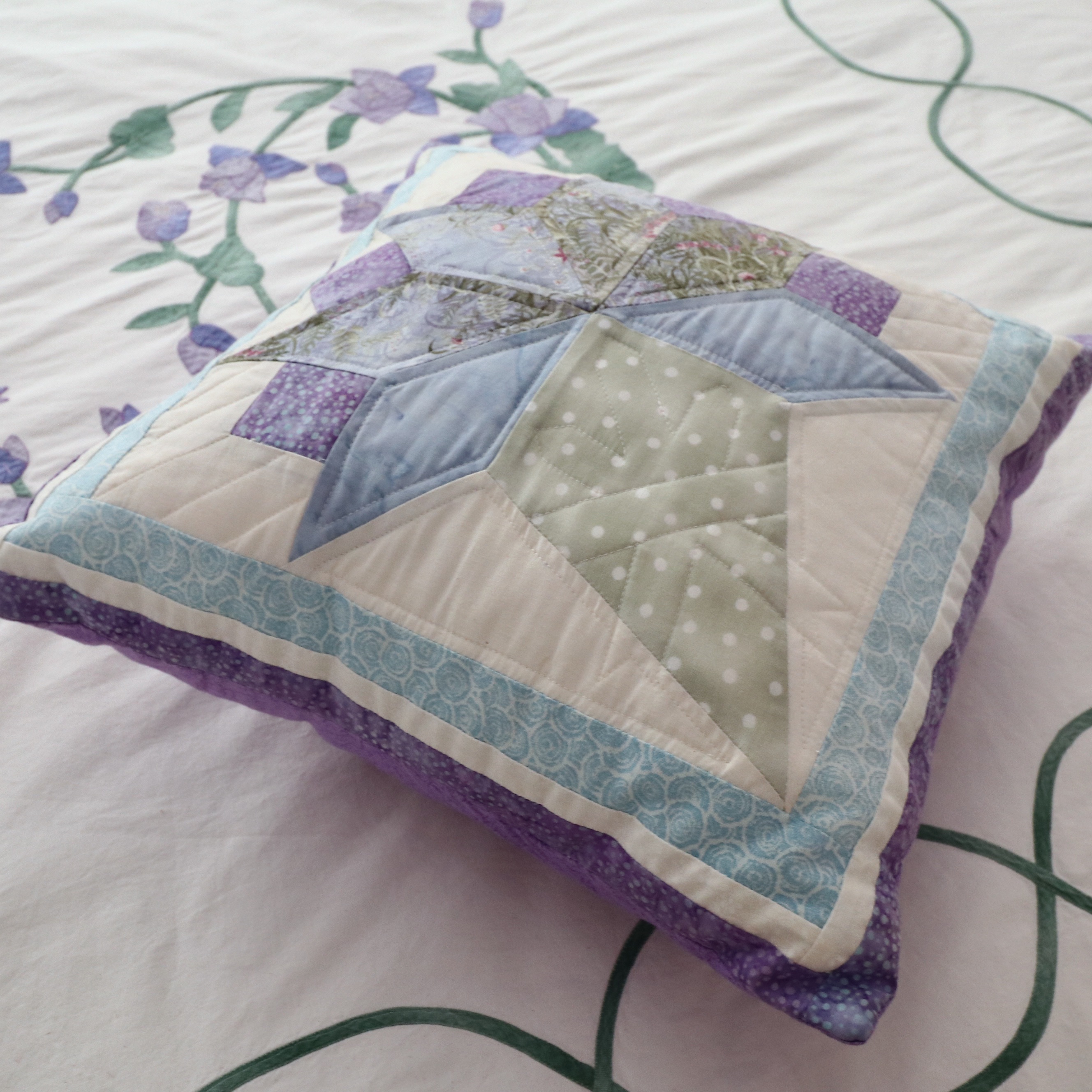 Wrought Iron Queen Bed Frame with Side Table and Floral Appliqué Cotton Bedding