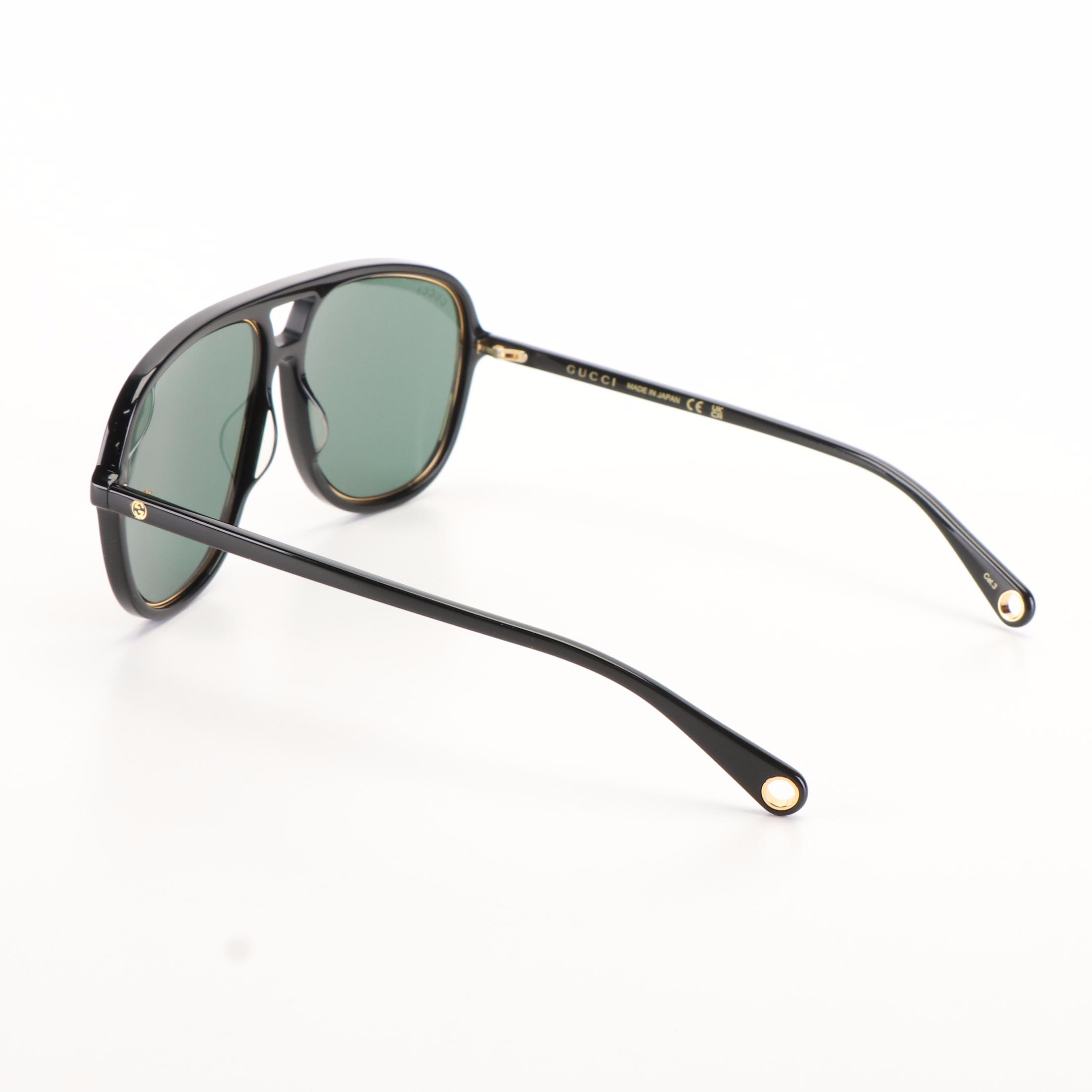 Gucci GG 1077S Aviator Sunglasses with Black Frames and Green Lenses