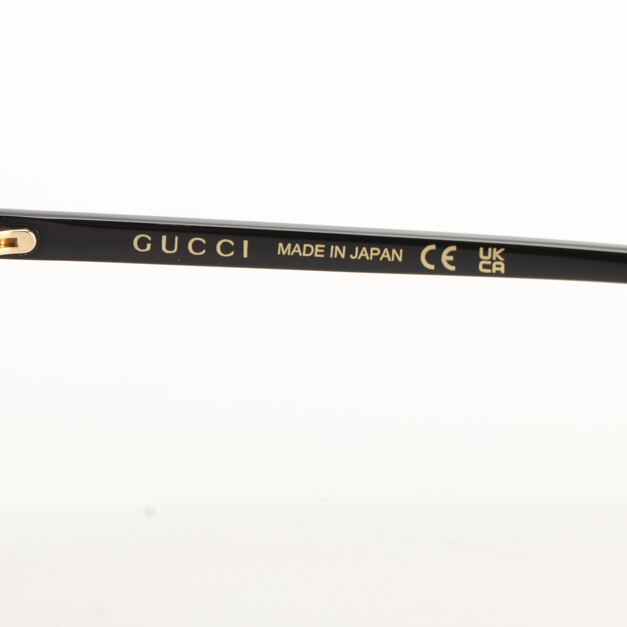Gucci GG 1077S Aviator Sunglasses with Black Frames and Green Lenses