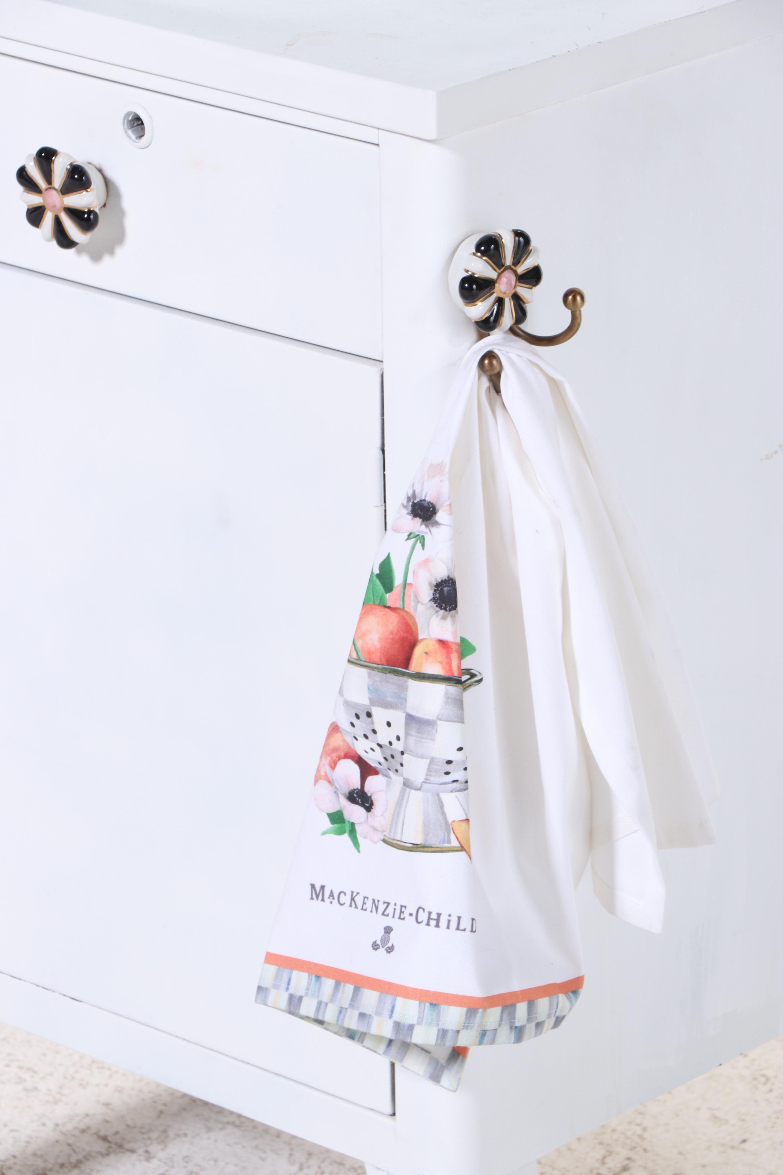 Bathroom Vanity with Glass Vessel Sink and MacKenzie-Childs Knobs and Towel