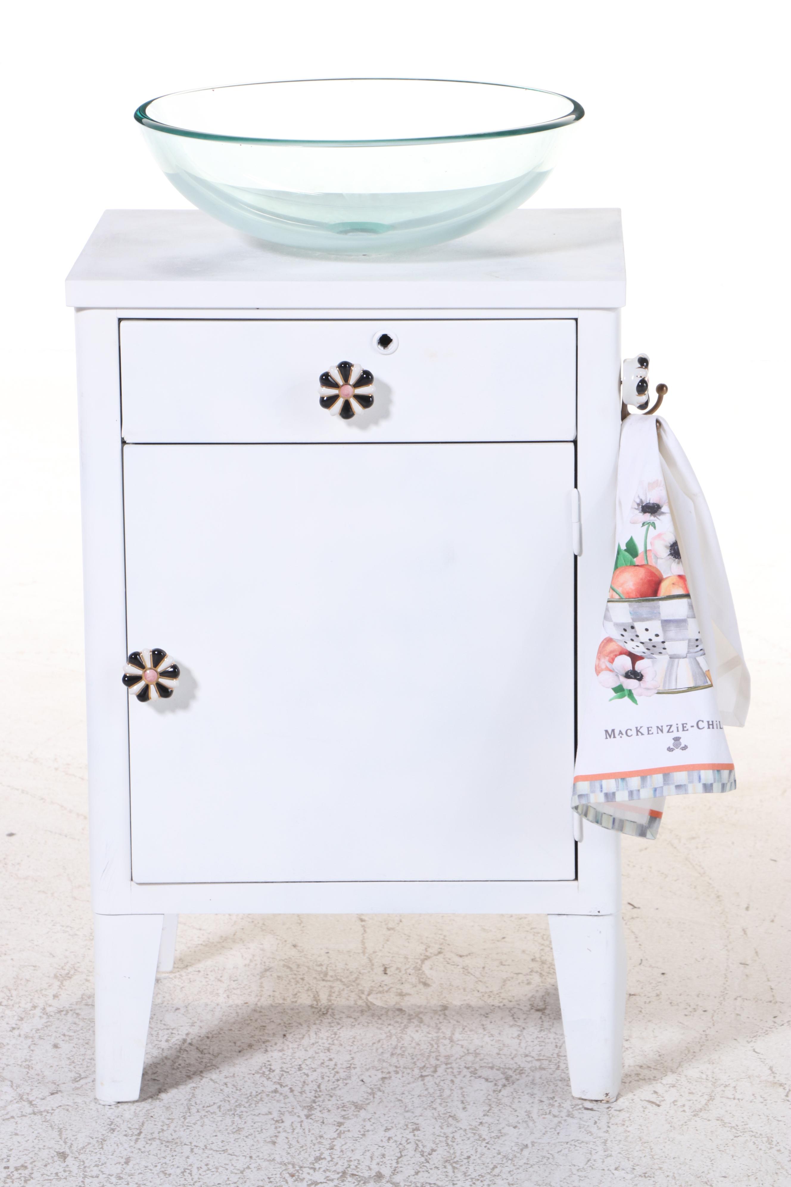 Bathroom Vanity with Glass Vessel Sink and MacKenzie-Childs Knobs and Towel