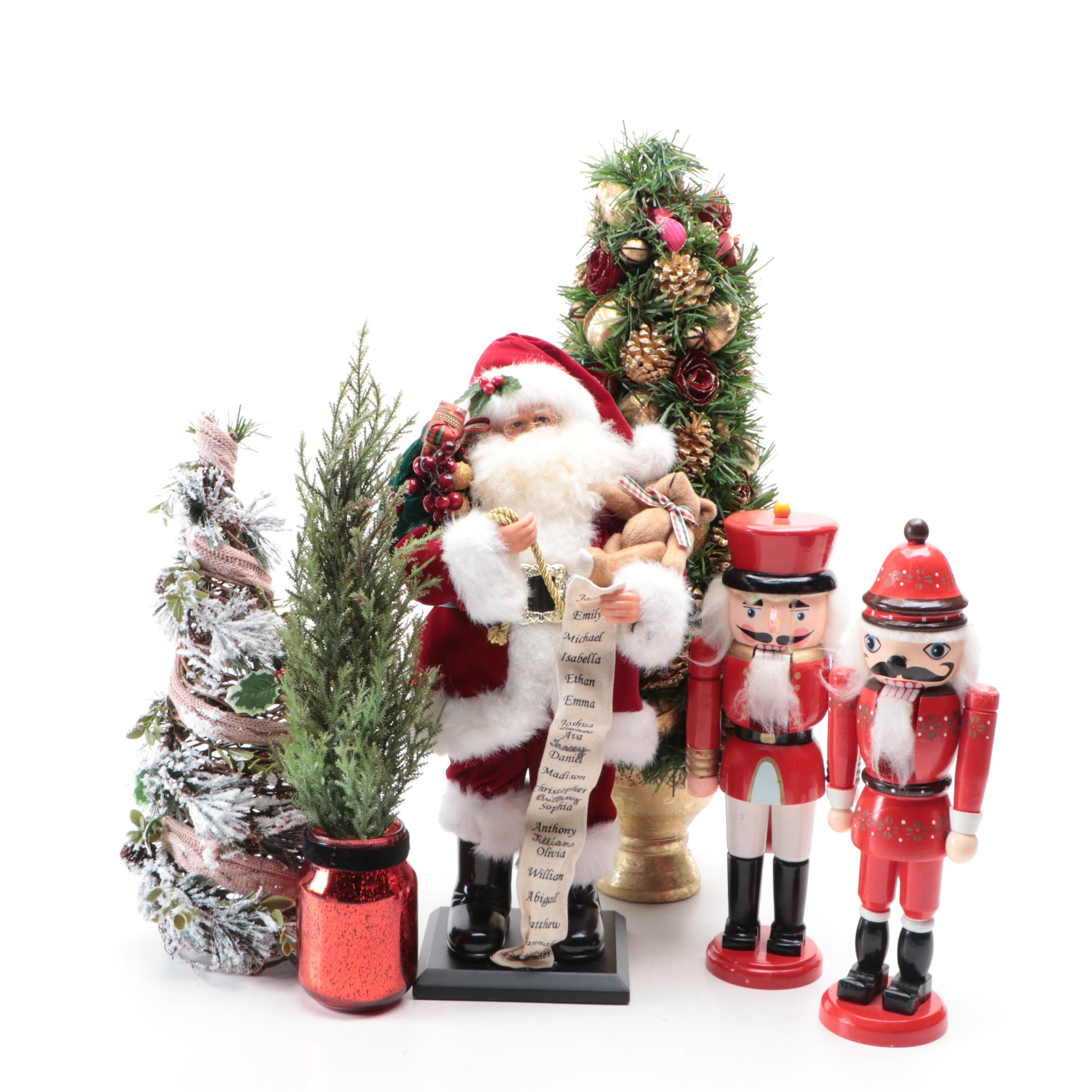 Wooden Nutcrackers with Santa Figurine and Artificial Greenery