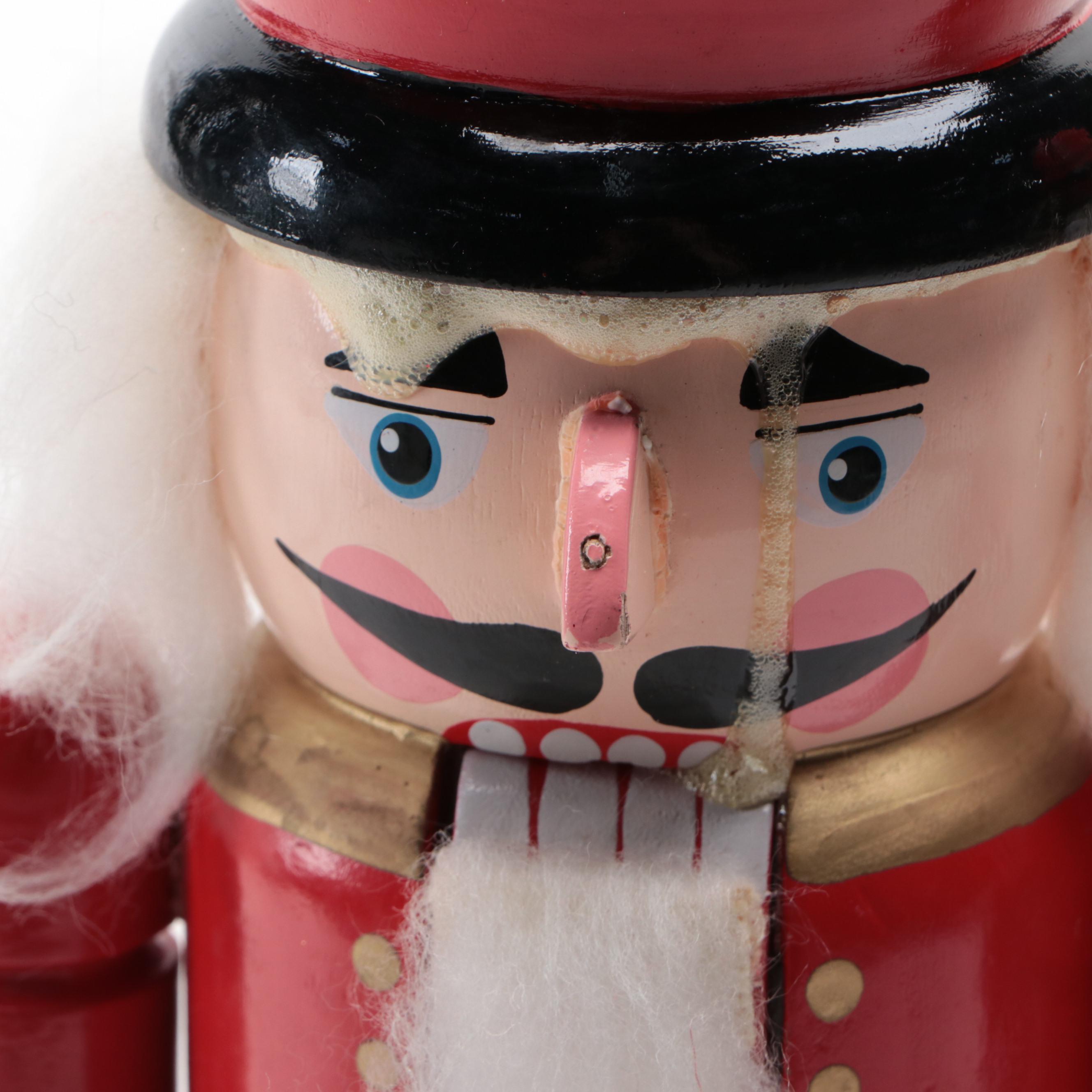 Wooden Nutcrackers with Santa Figurine and Artificial Greenery