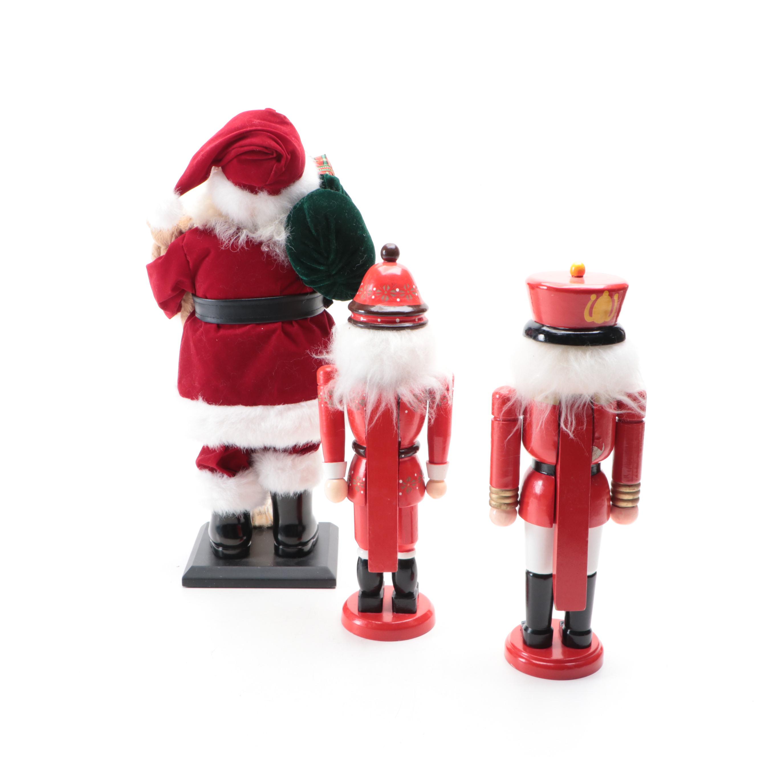 Wooden Nutcrackers with Santa Figurine and Artificial Greenery