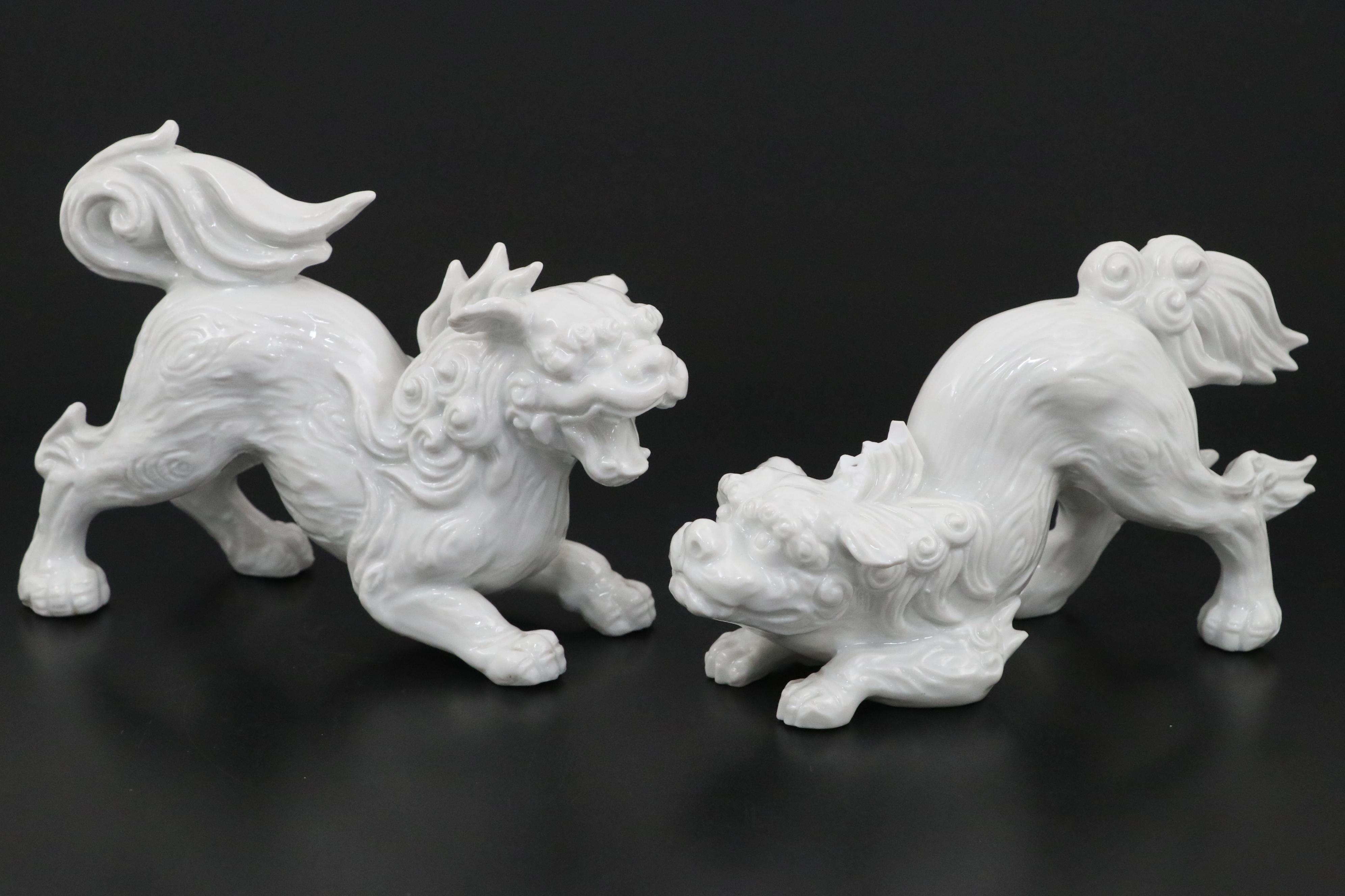 Chinese Blanc de Chine and Resin Guardian Lion Figurine Pairs