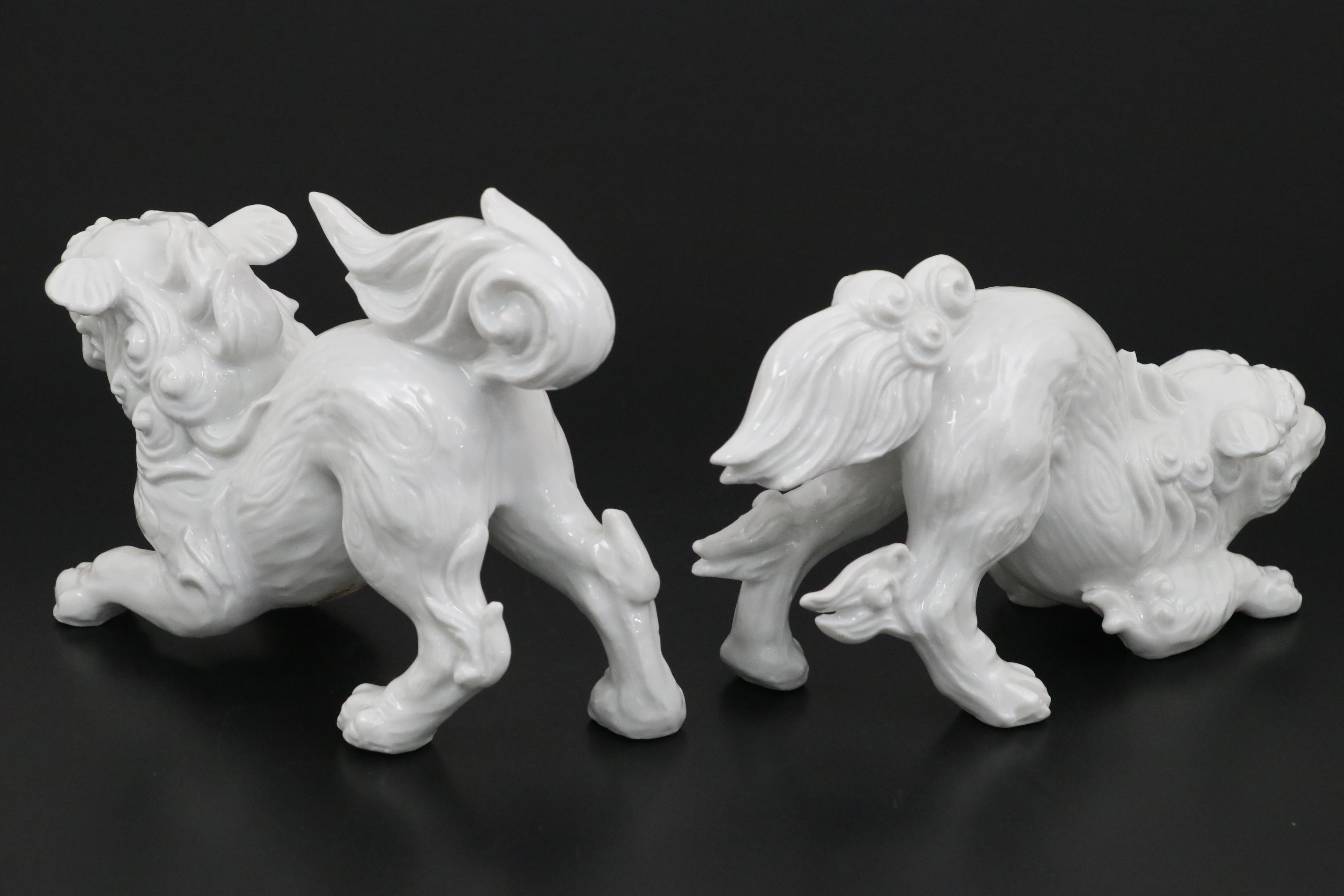 Chinese Blanc de Chine and Resin Guardian Lion Figurine Pairs