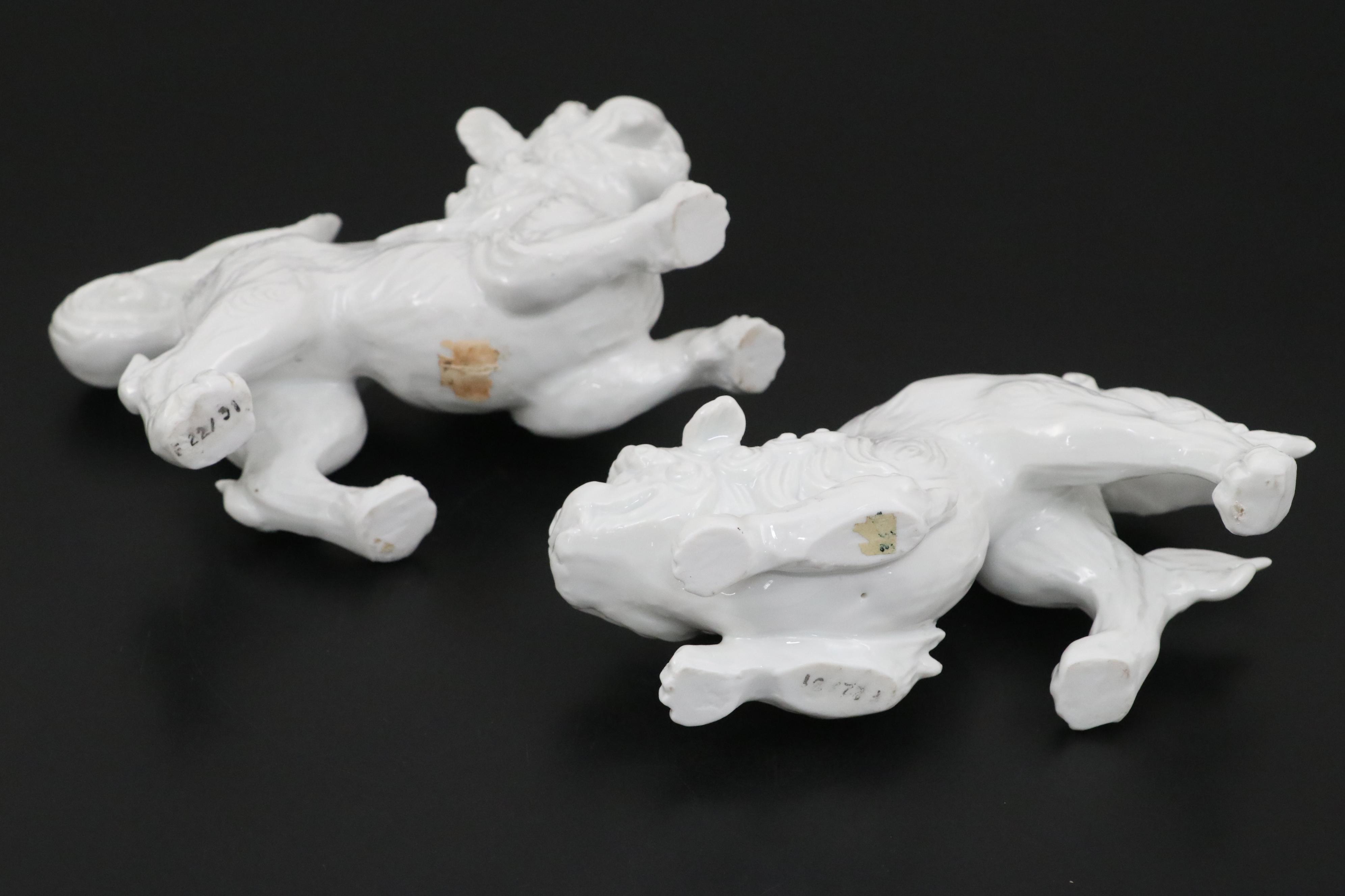Chinese Blanc de Chine and Resin Guardian Lion Figurine Pairs