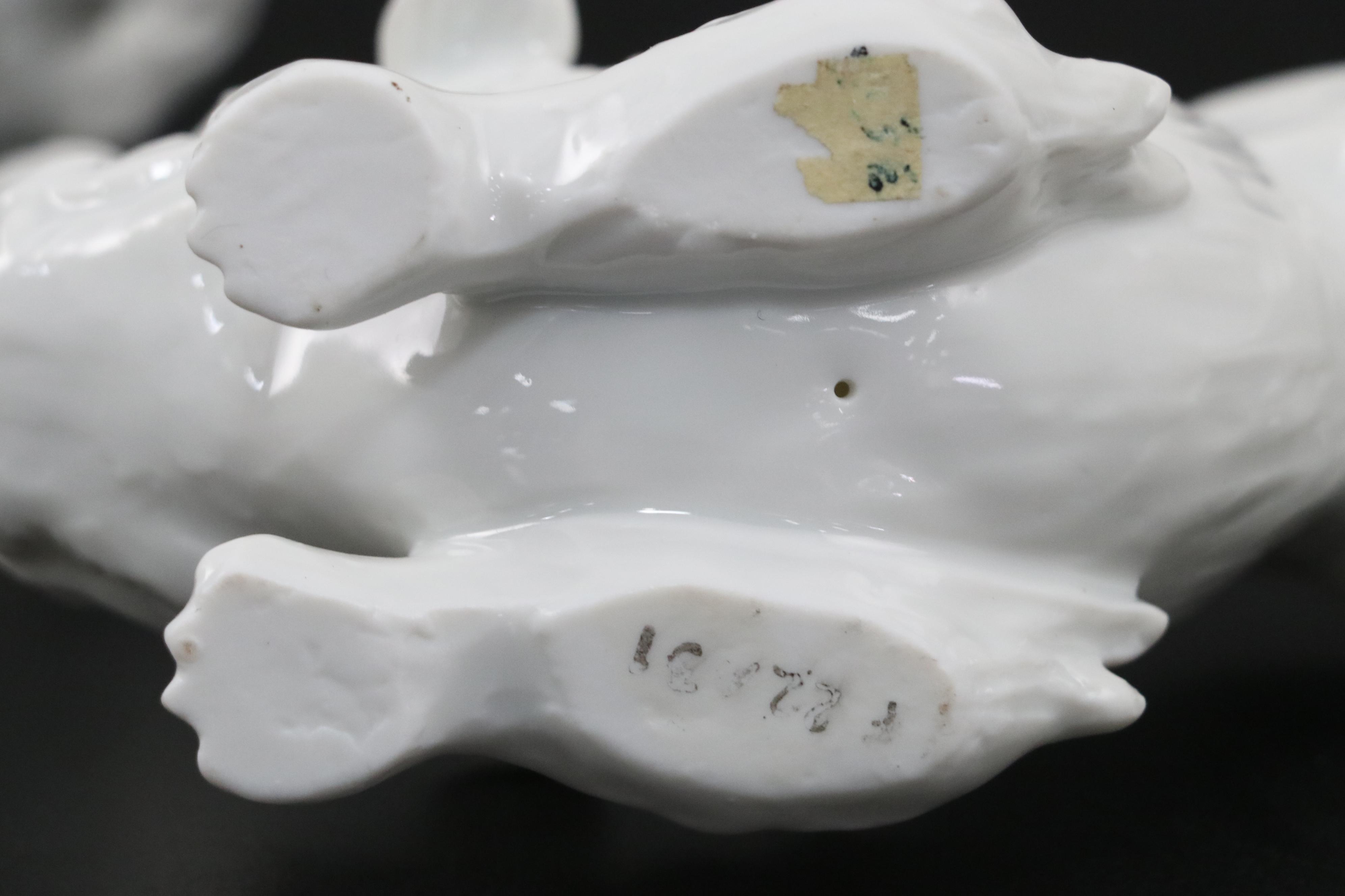 Chinese Blanc de Chine and Resin Guardian Lion Figurine Pairs