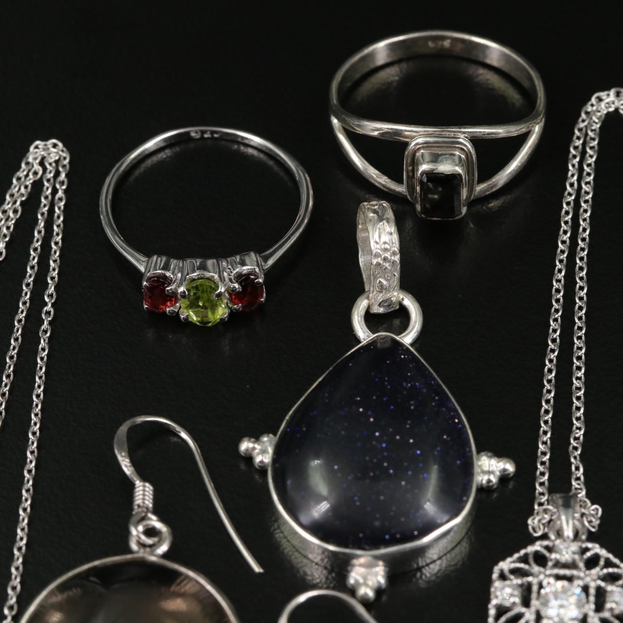 Group of 14 Assorted Sterling Silver Rings, Necklaces, Earrings, and Pendants