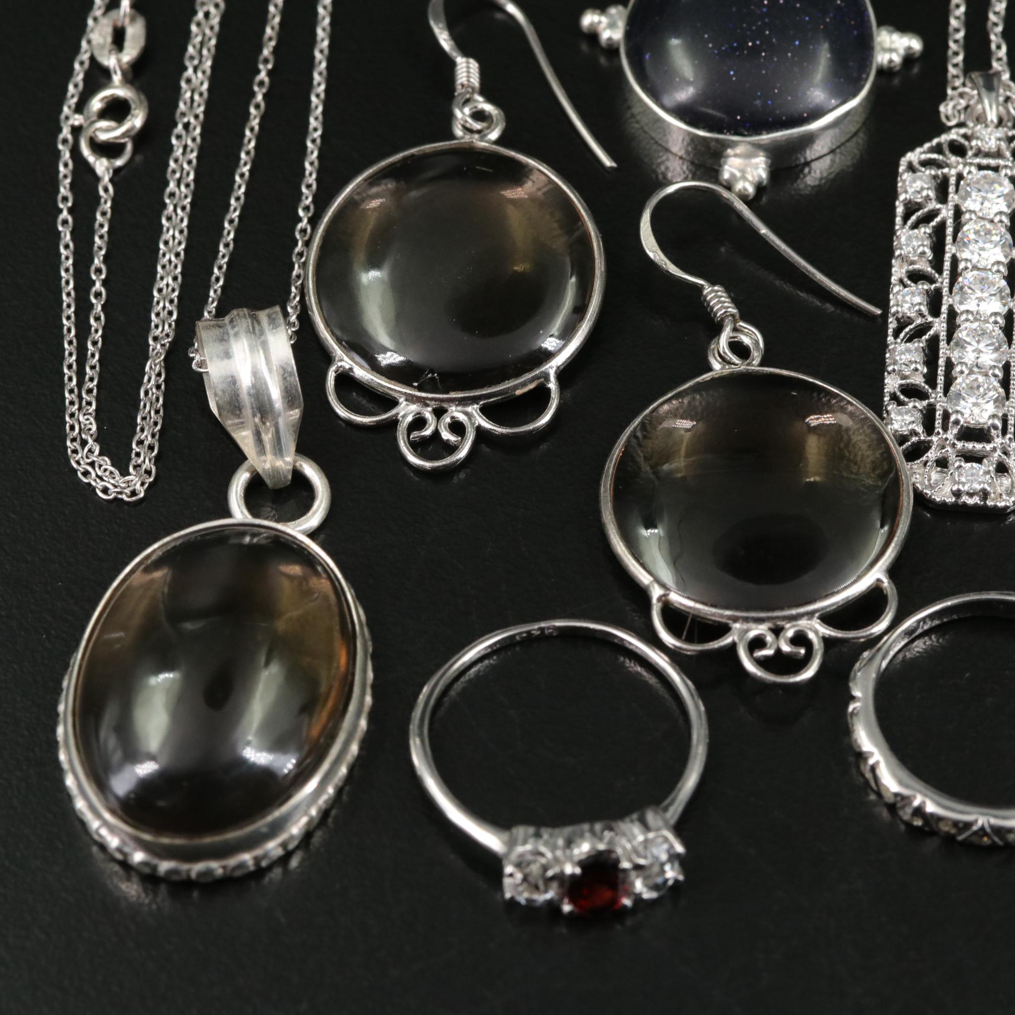 Group of 14 Assorted Sterling Silver Rings, Necklaces, Earrings, and Pendants
