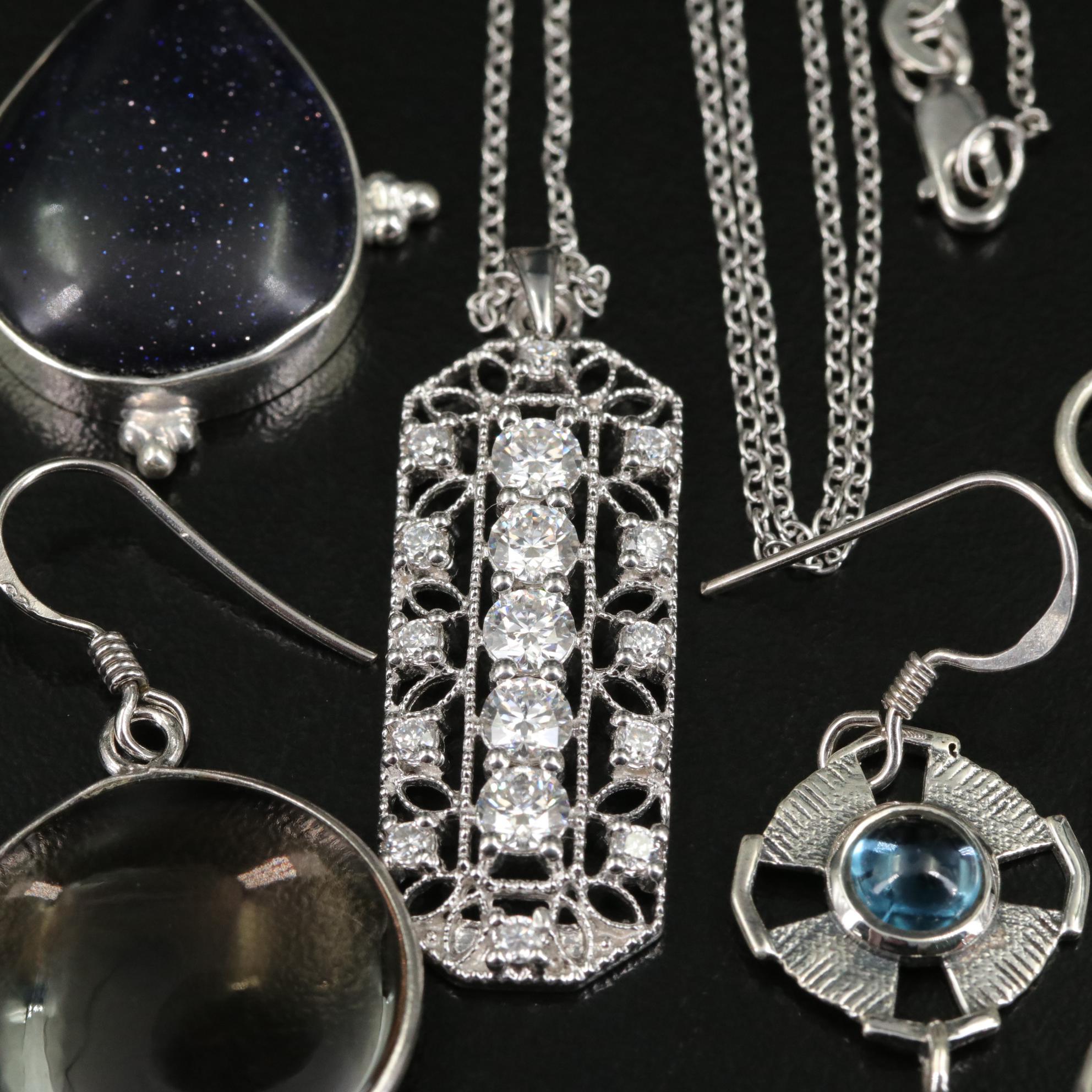 Group of 14 Assorted Sterling Silver Rings, Necklaces, Earrings, and Pendants