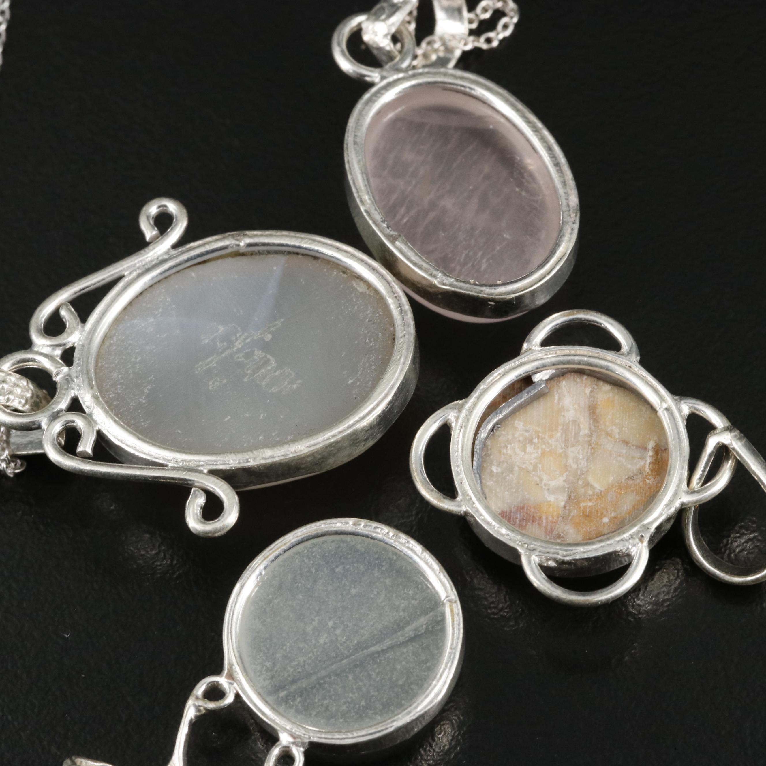 Group of 14 Assorted Sterling Silver Rings, Necklaces, Earrings, and Pendants