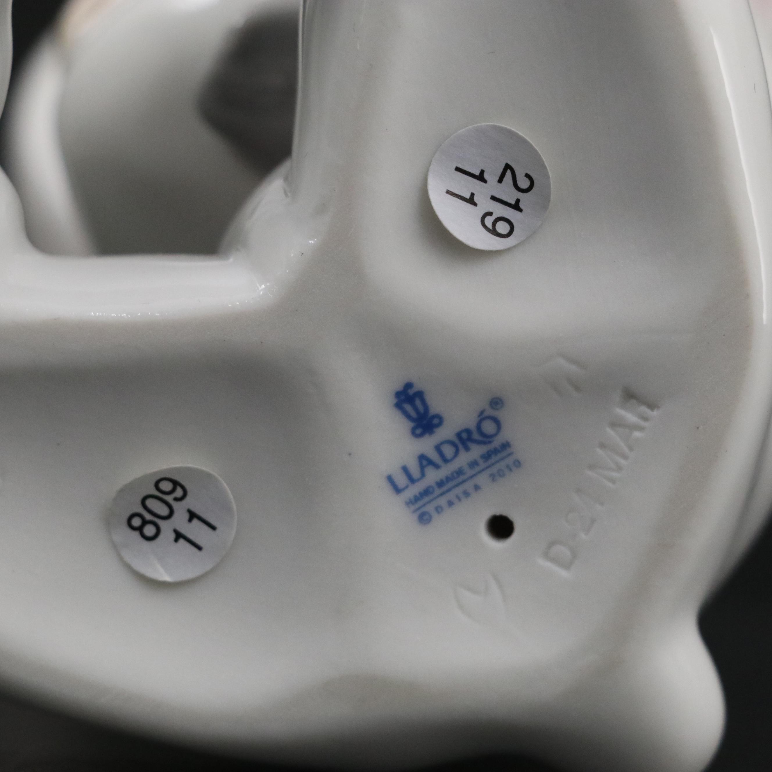 Lladró "Young Harlequin" Holding a Cat and "Bunny Hugs" Porcelain Figurines