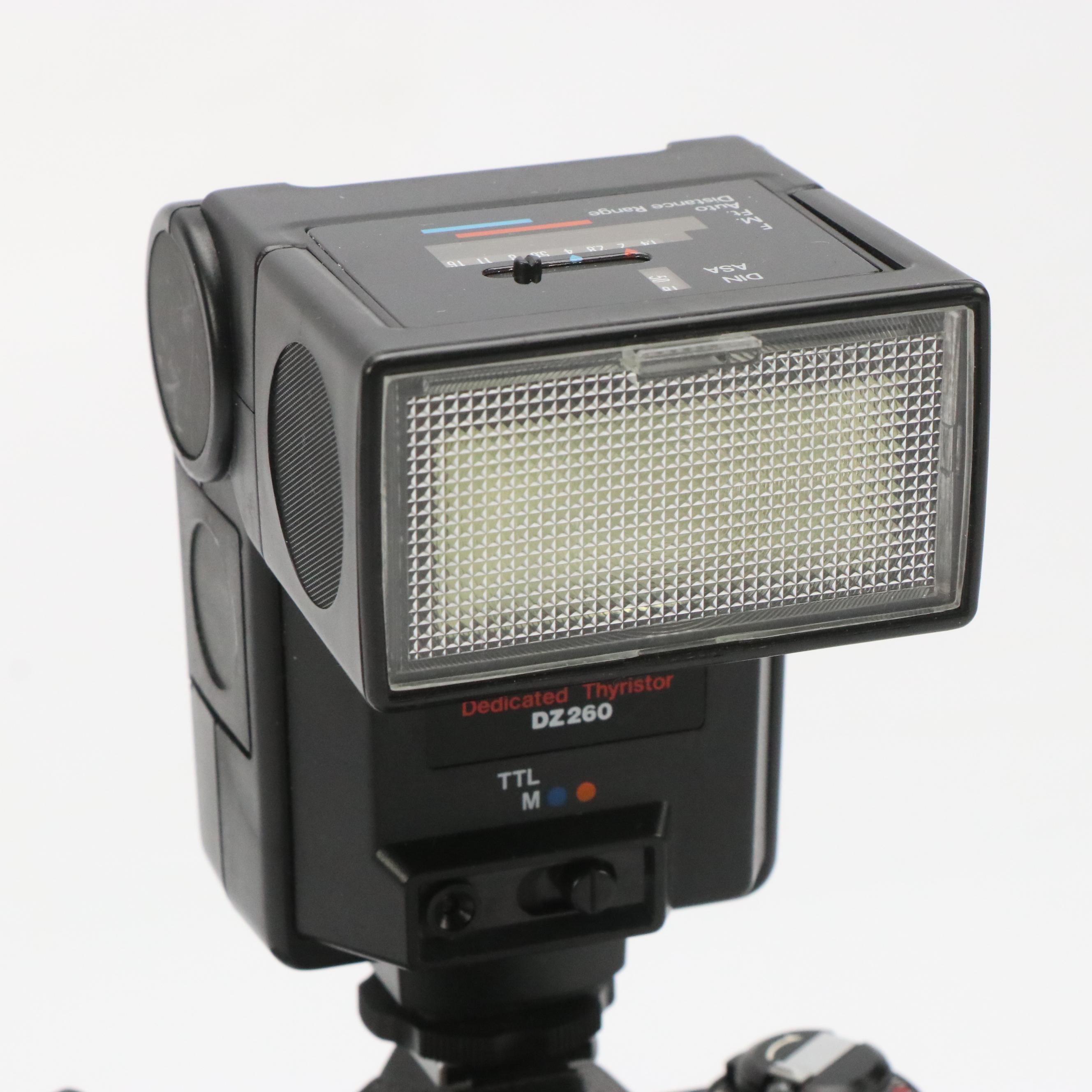 Nikon EM Camera, MD-12 Motor Drive Unit, Achiever Flash and More