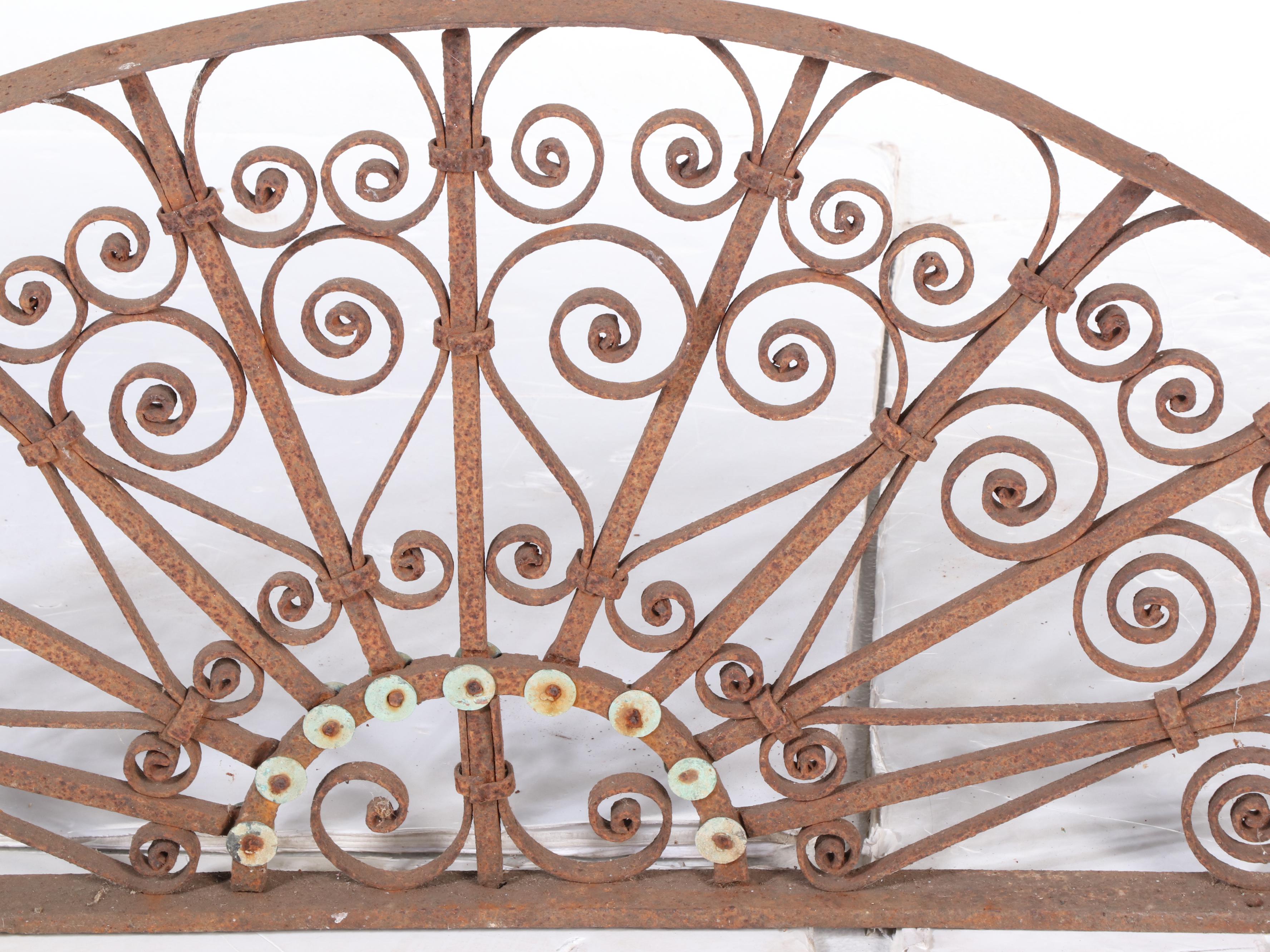 Two Late Victorian Wrought Iron Transom Window Screens