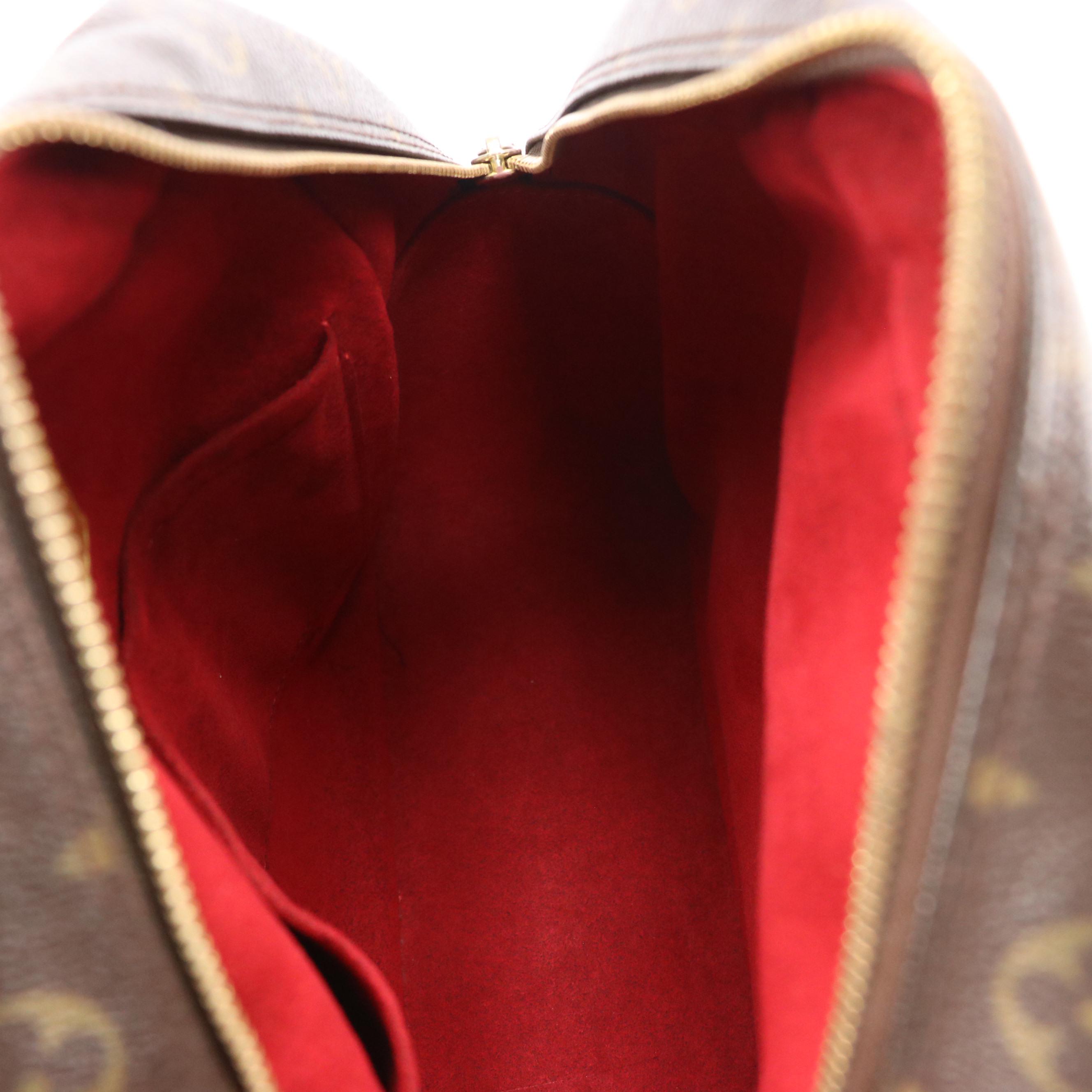 Louis Vuitton Excentri Cité Handbag in Monogram Canvas and Vachetta Leather