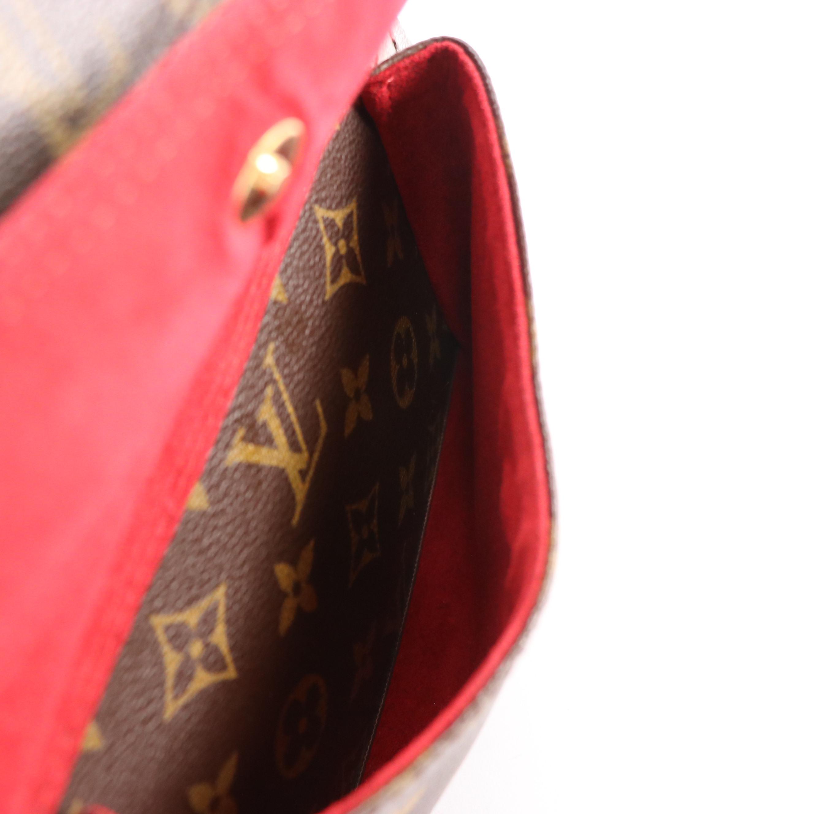 Louis Vuitton Excentri Cité Handbag in Monogram Canvas and Vachetta Leather
