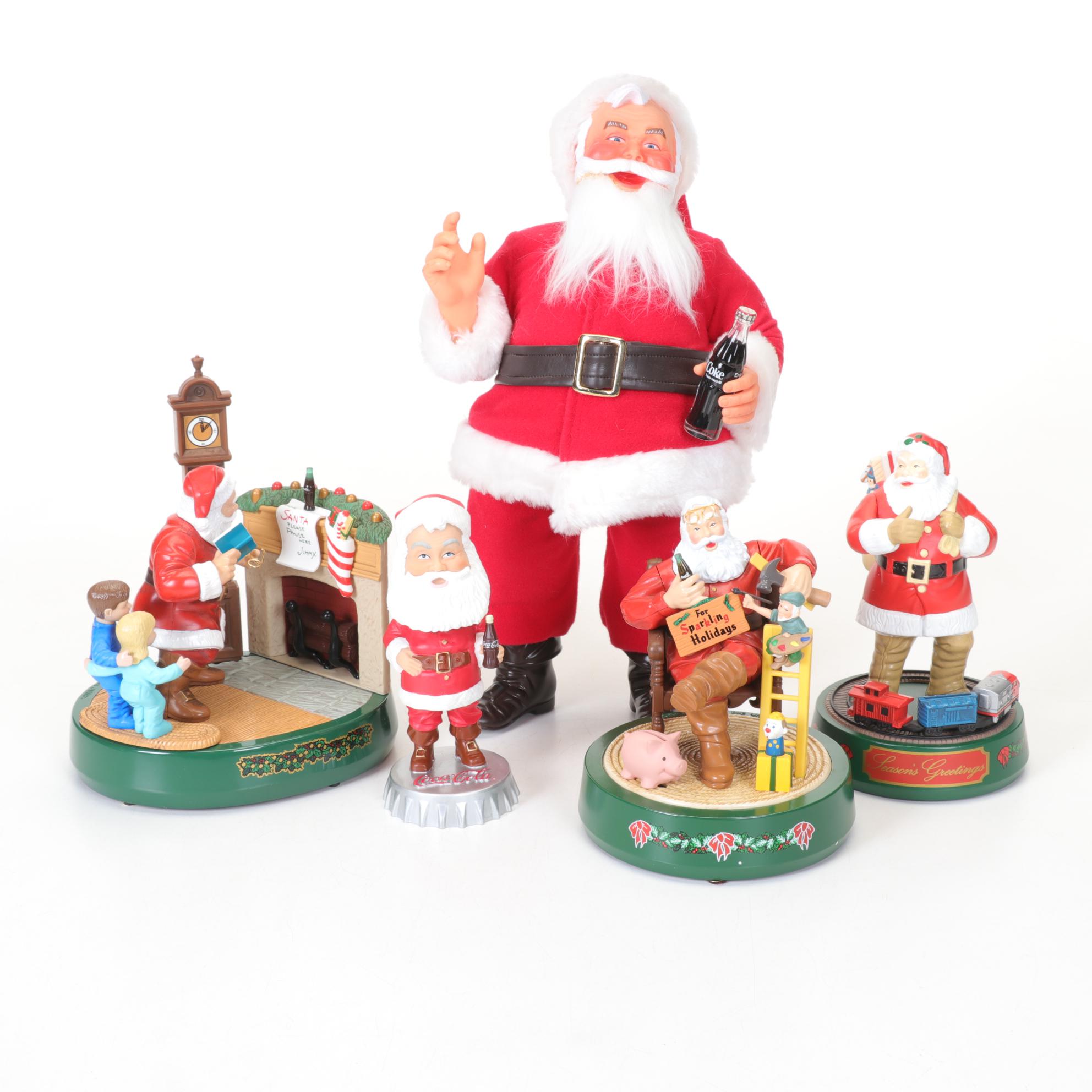 Coca-Cola Christmas Decorations with Three Banks, a Figurine, and a Bobblehead