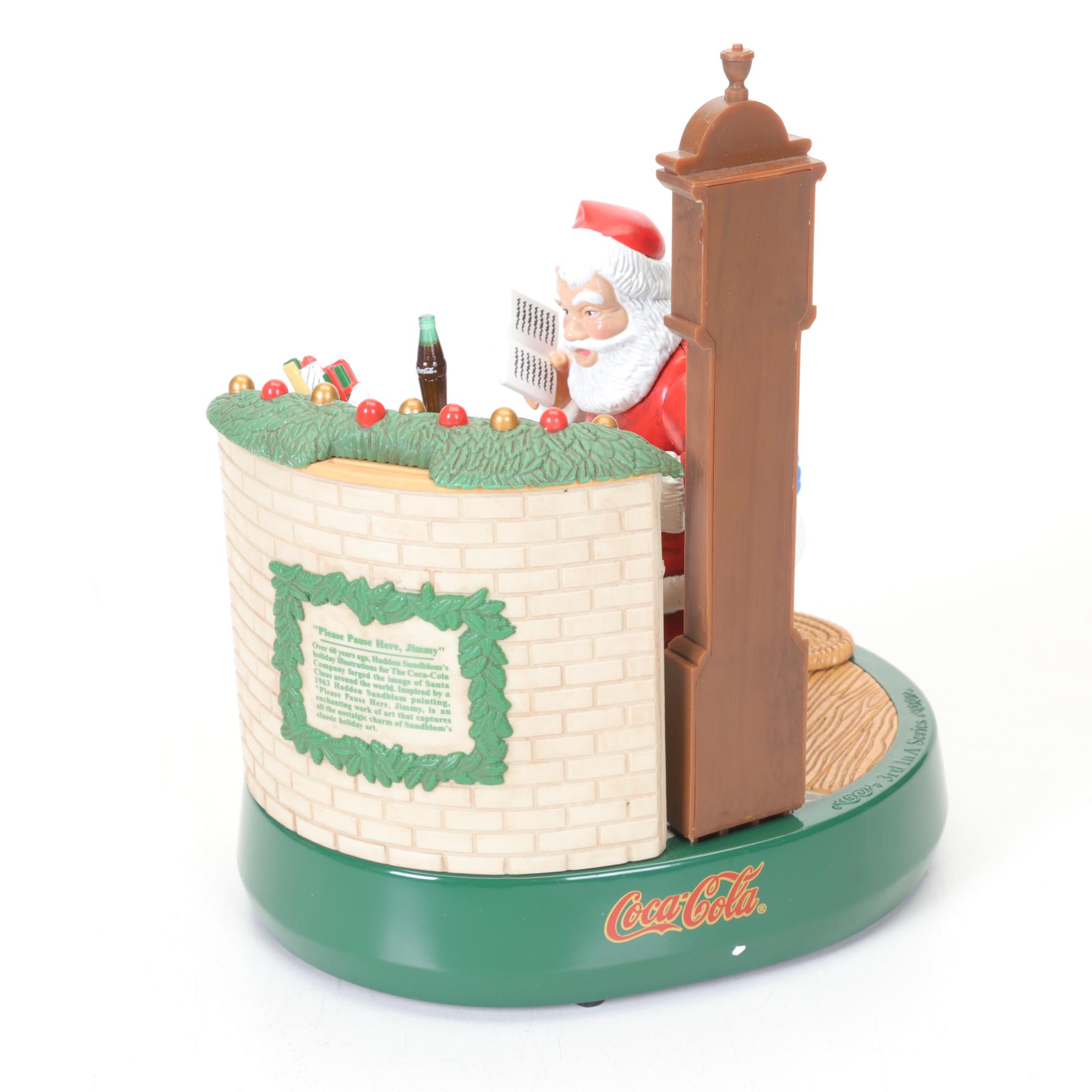 Coca-Cola Christmas Decorations with Three Banks, a Figurine, and a Bobblehead