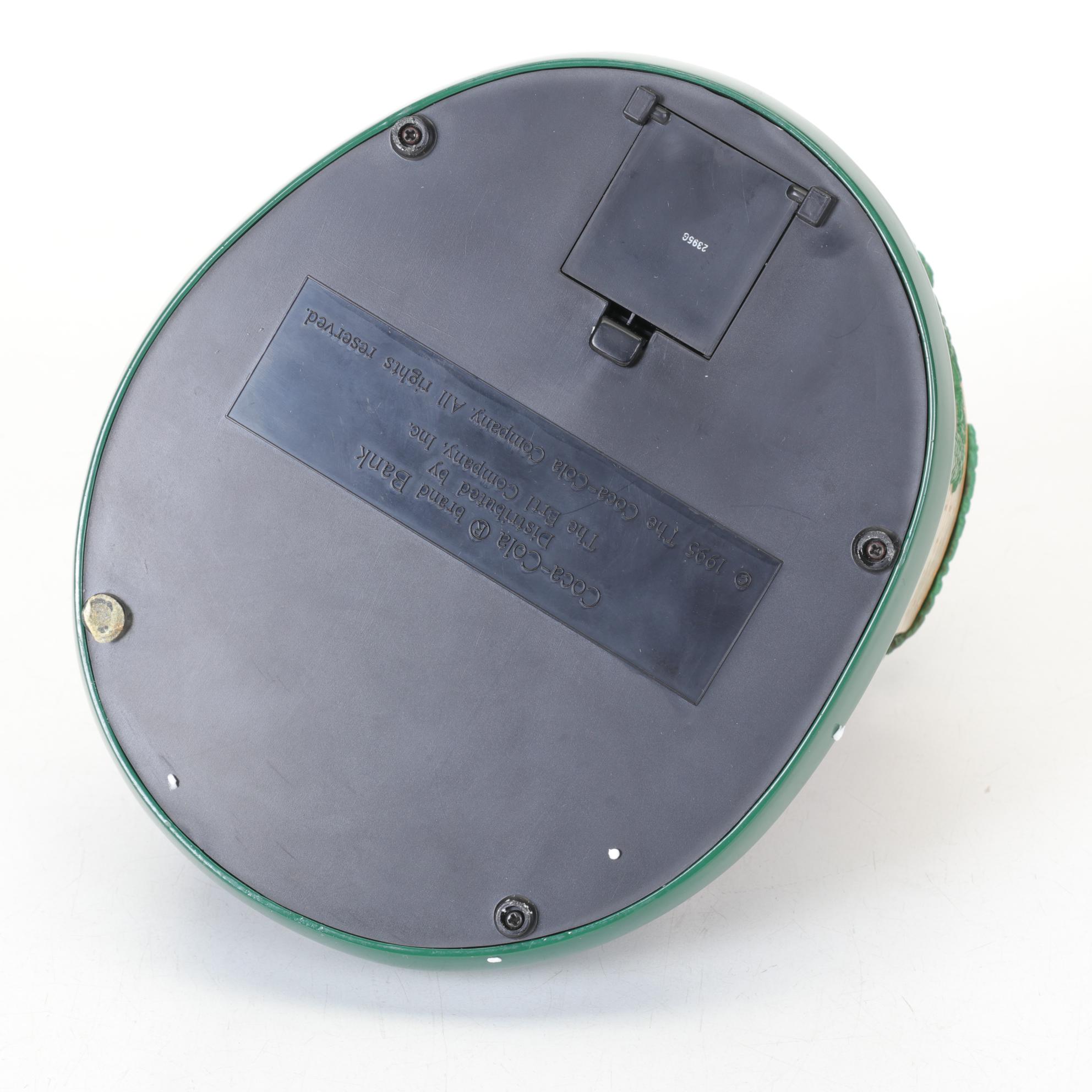 Coca-Cola Christmas Decorations with Three Banks, a Figurine, and a Bobblehead