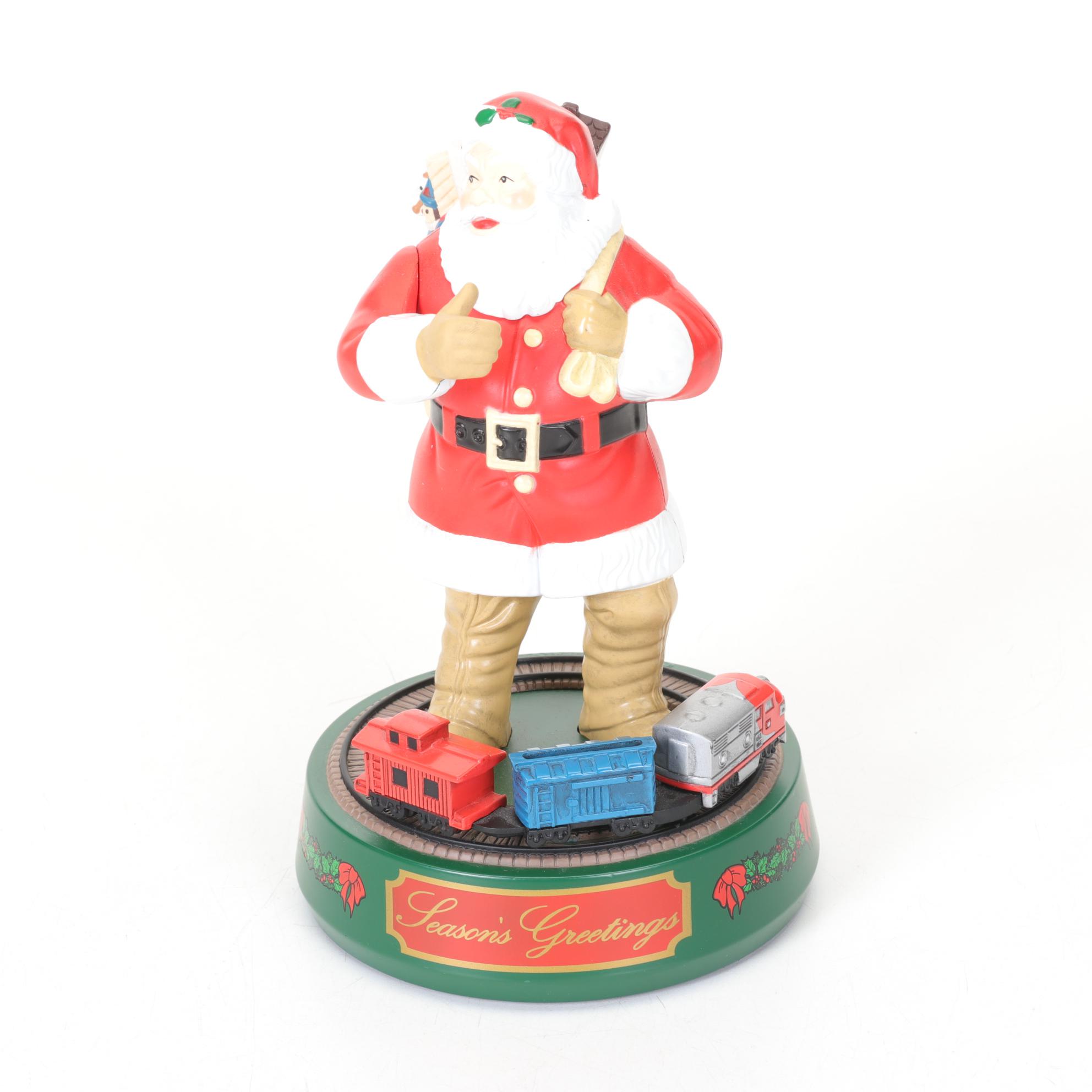 Coca-Cola Christmas Decorations with Three Banks, a Figurine, and a Bobblehead