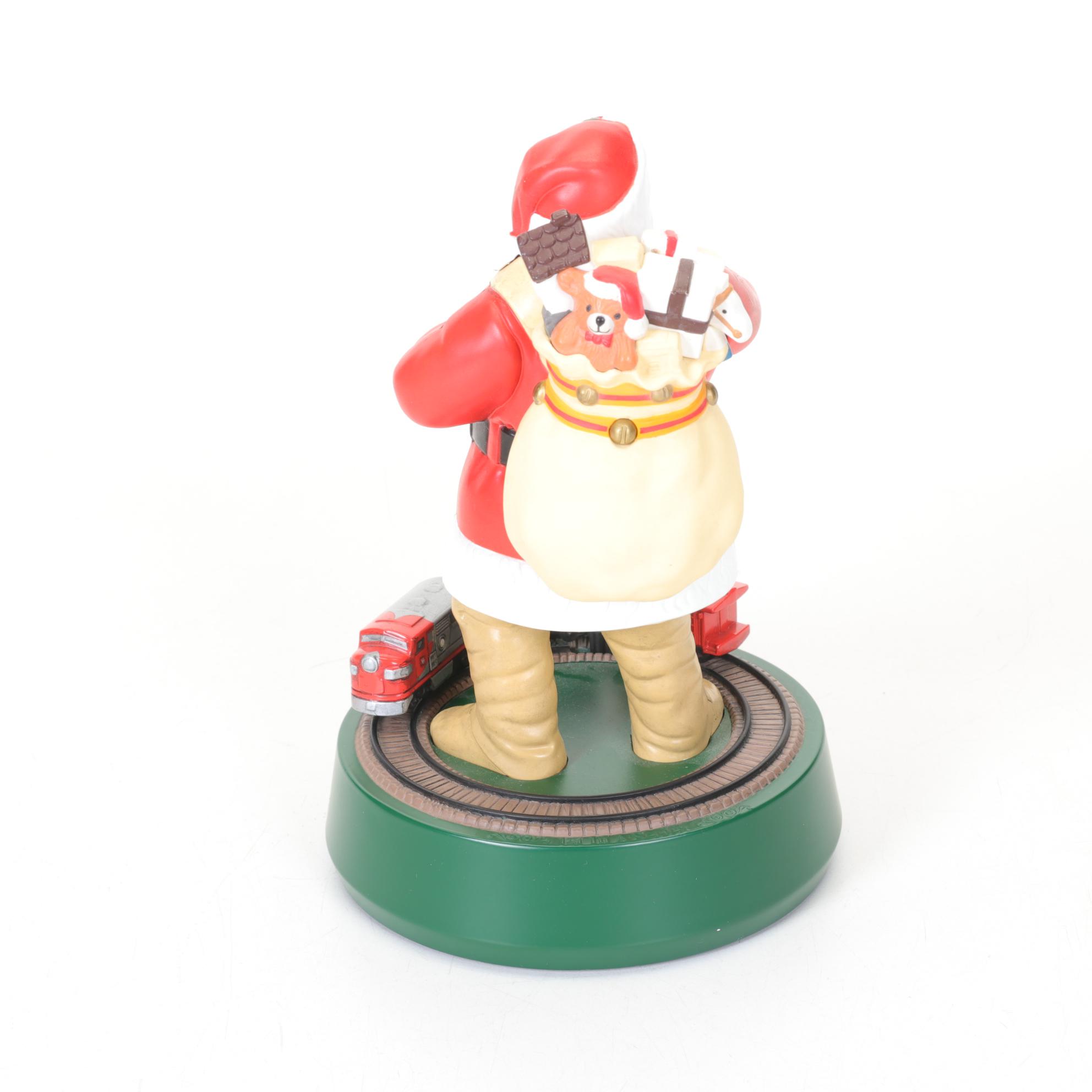 Coca-Cola Christmas Decorations with Three Banks, a Figurine, and a Bobblehead