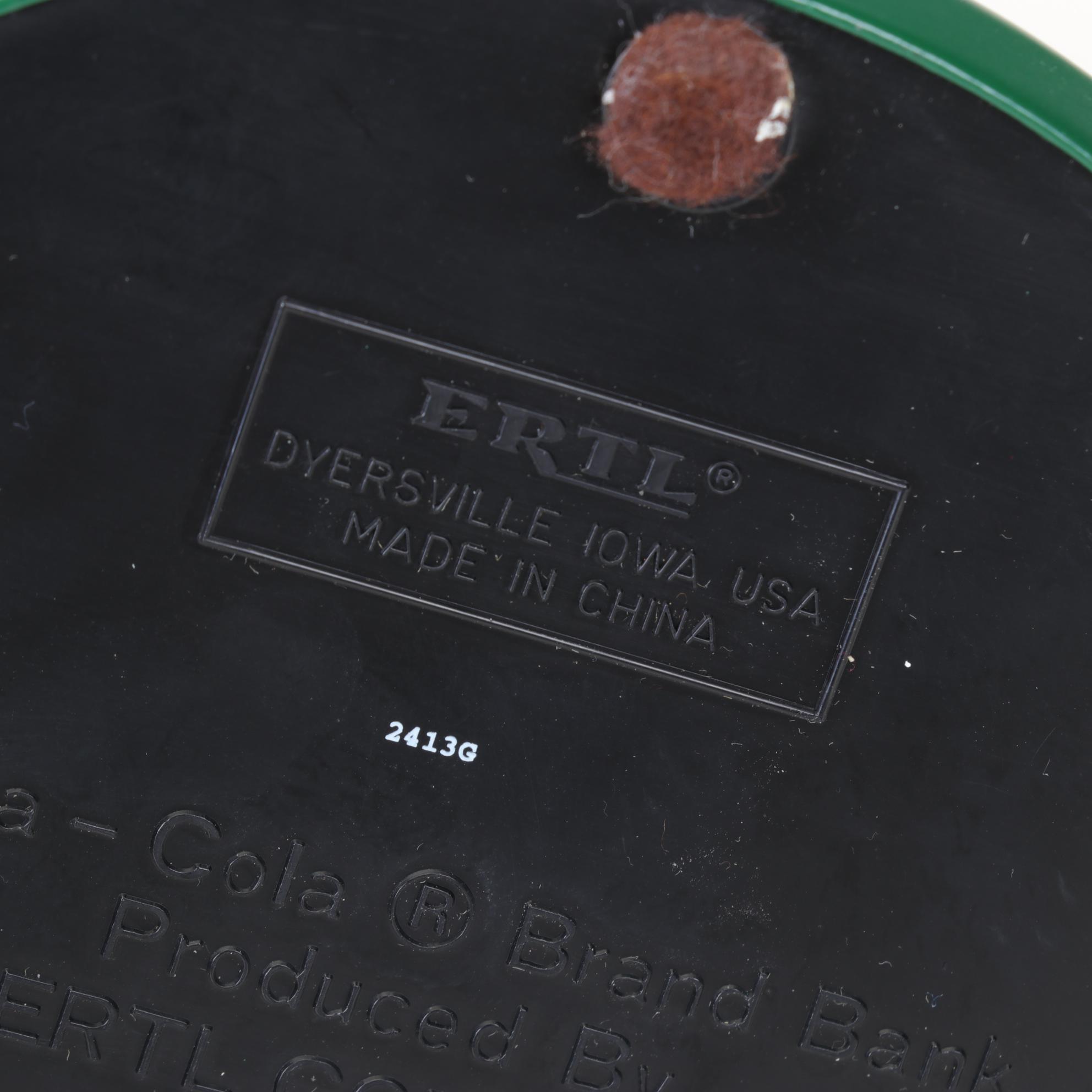 Coca-Cola Christmas Decorations with Three Banks, a Figurine, and a Bobblehead