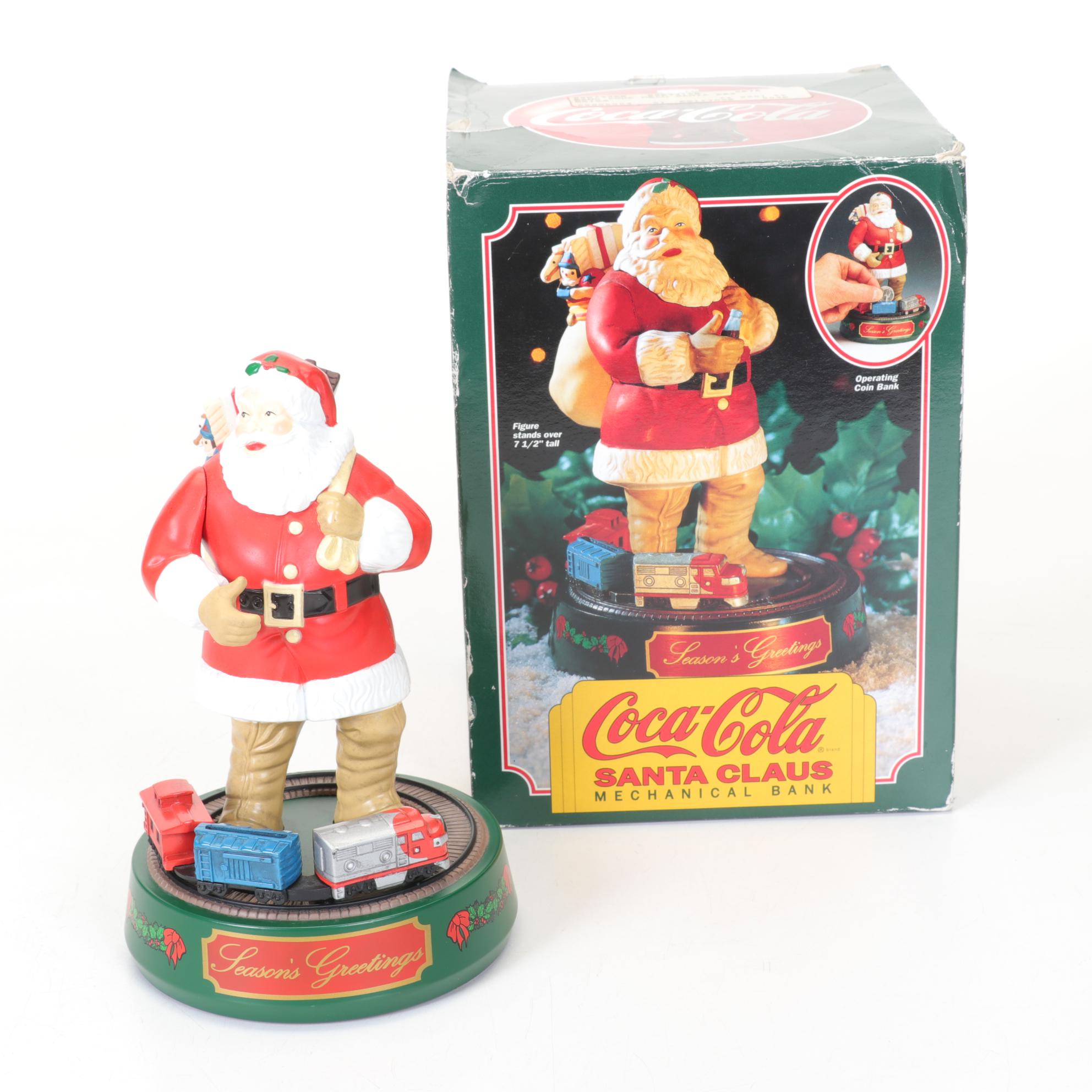 Coca-Cola Christmas Decorations with Three Banks, a Figurine, and a Bobblehead