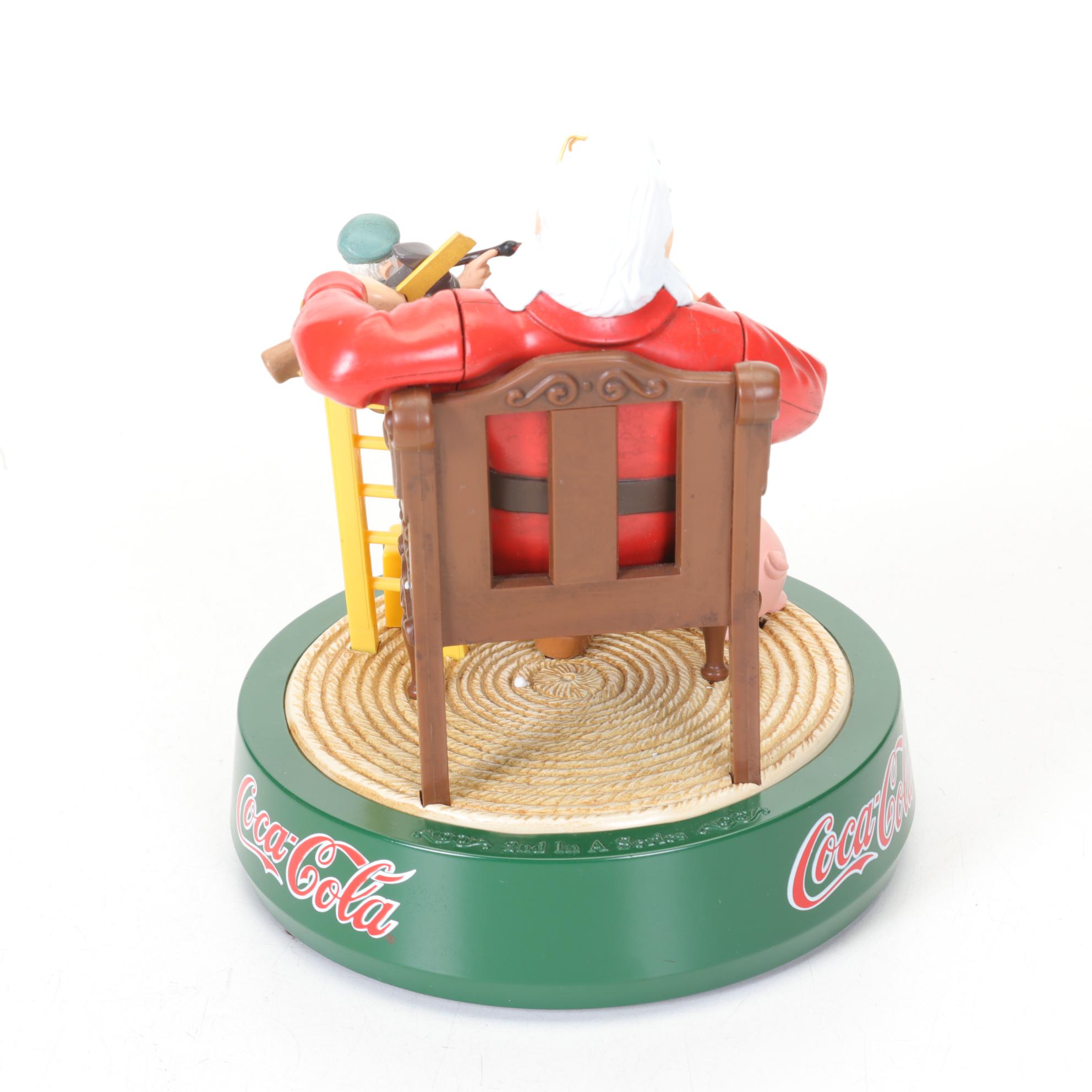 Coca-Cola Christmas Decorations with Three Banks, a Figurine, and a Bobblehead